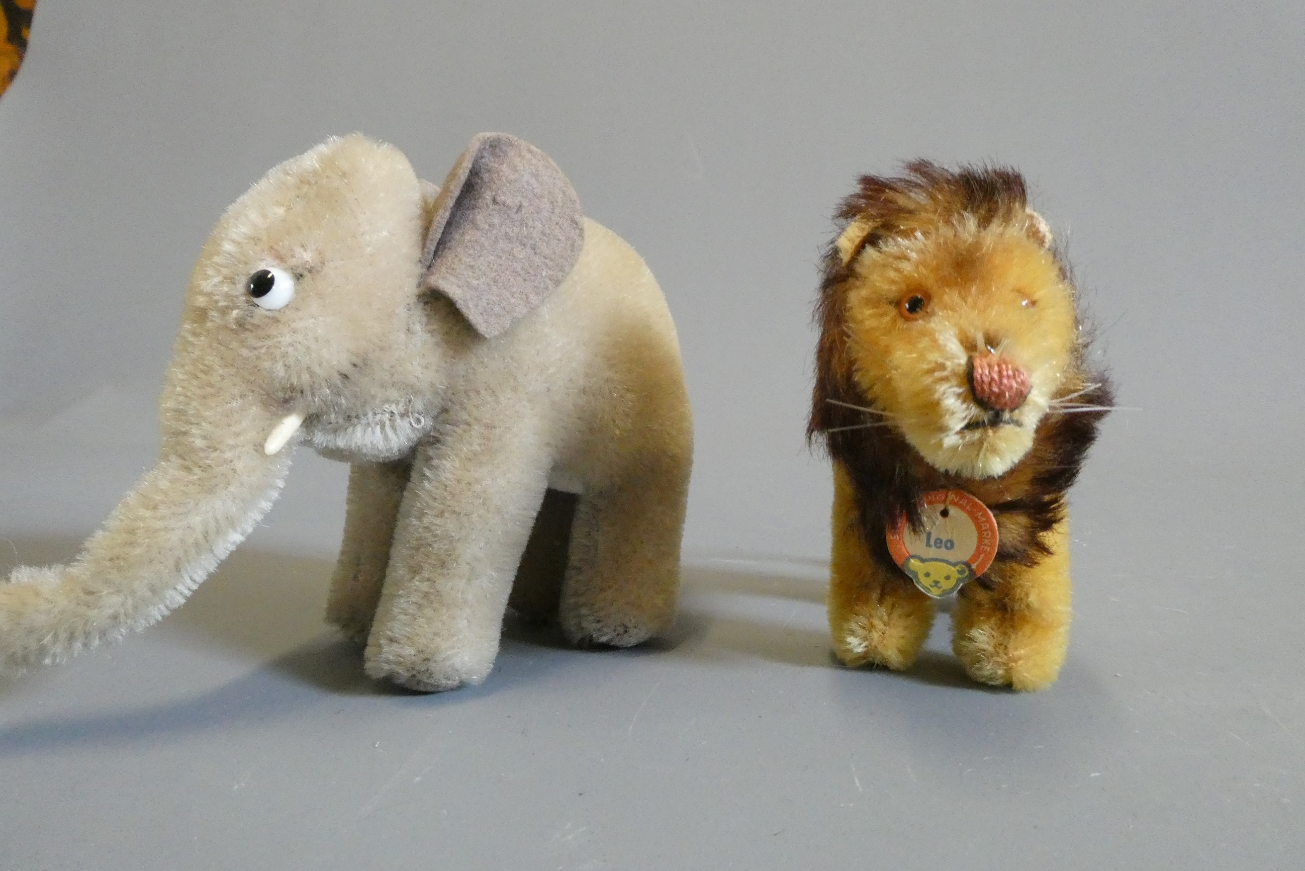 Six Steiff plush animals comprising two bambi's, two elephants, a Leo lion and a small squirrel Image