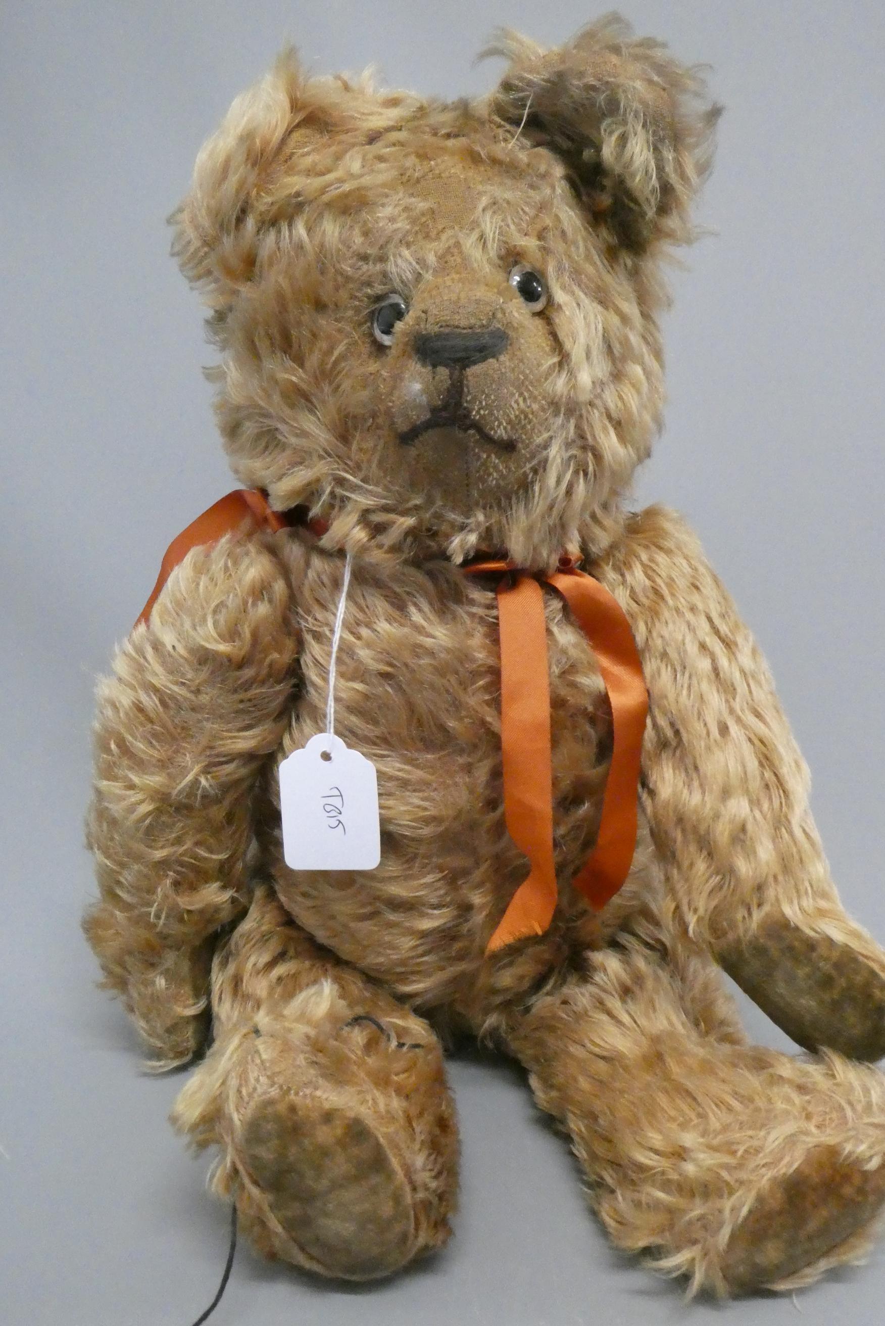 A pre-war cinnamon long haired teddy bear, with sewn nose, clear glass eyes ands felt pads, 19 1/2" Image