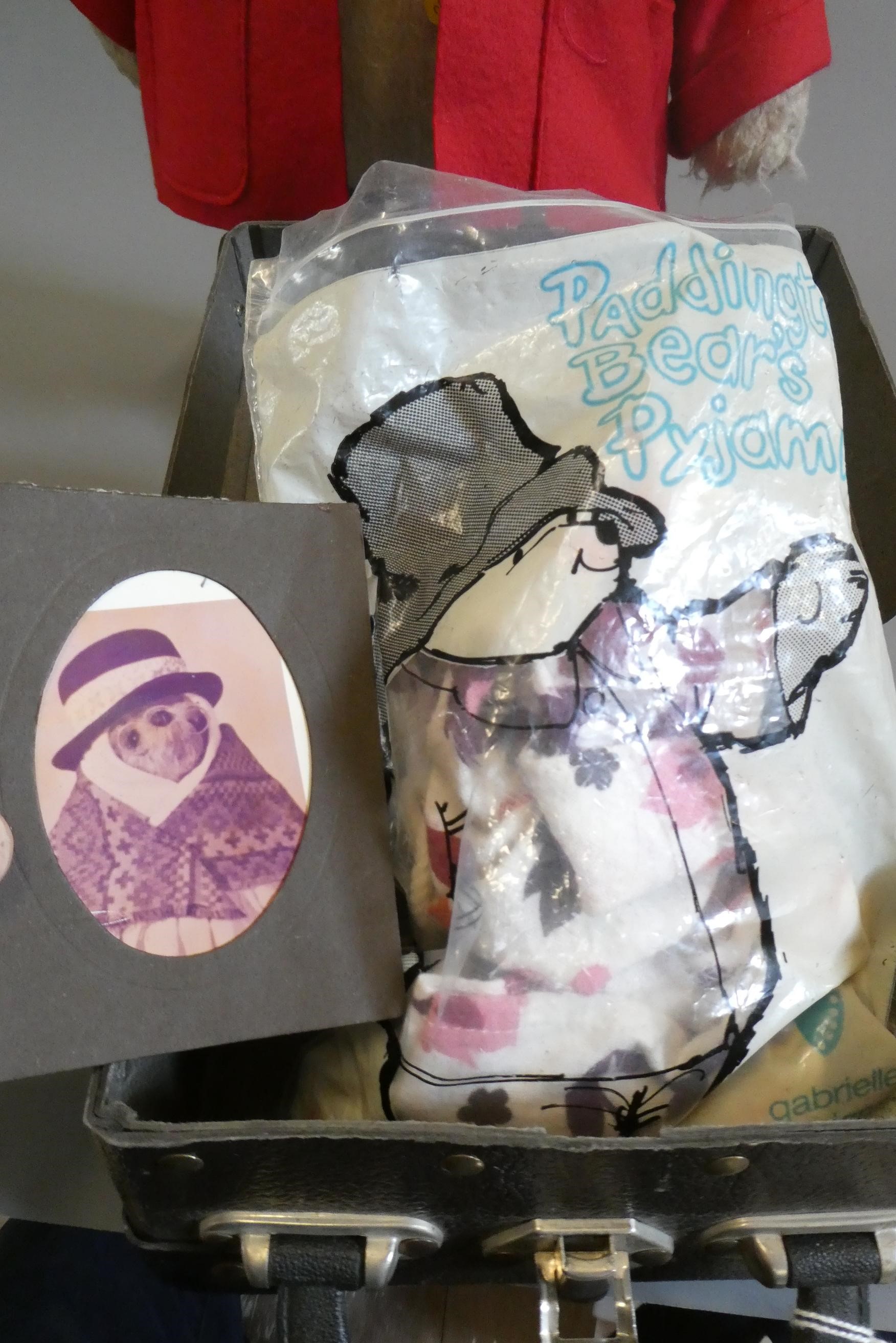 A vintage Paddington Bear, with red felt coat, brown felt hat, blue Dunlop boots, suitcase and Image