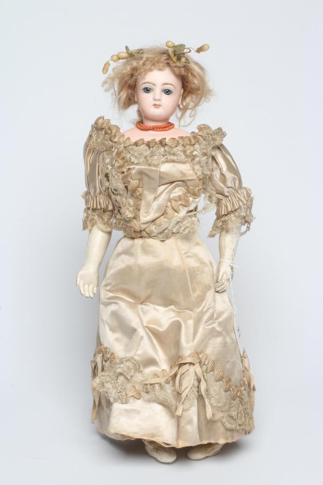 A Jumeau bisque shoulder head doll with blue glass fixed eyes Image