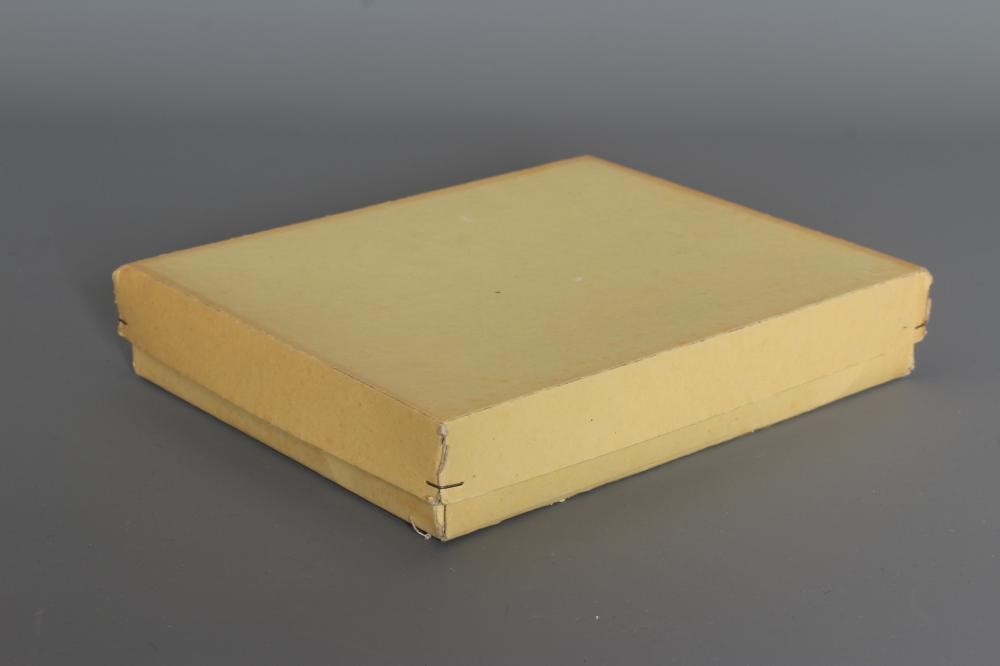 A boxed set of ten all bisque miniature dolls Image