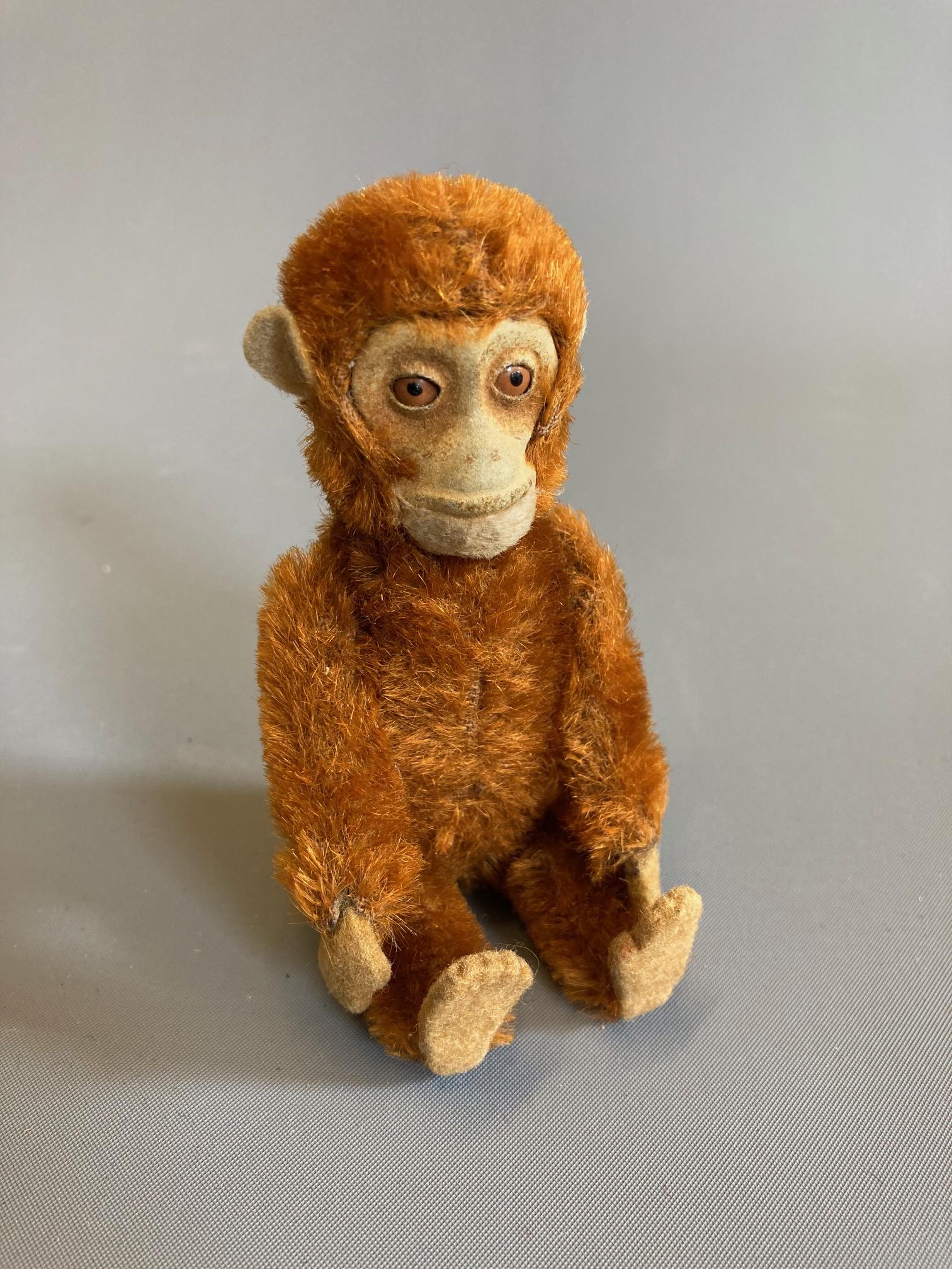 A Schuco plush monkey scent bottle with removable head and internal glass vial, with felt face, Image