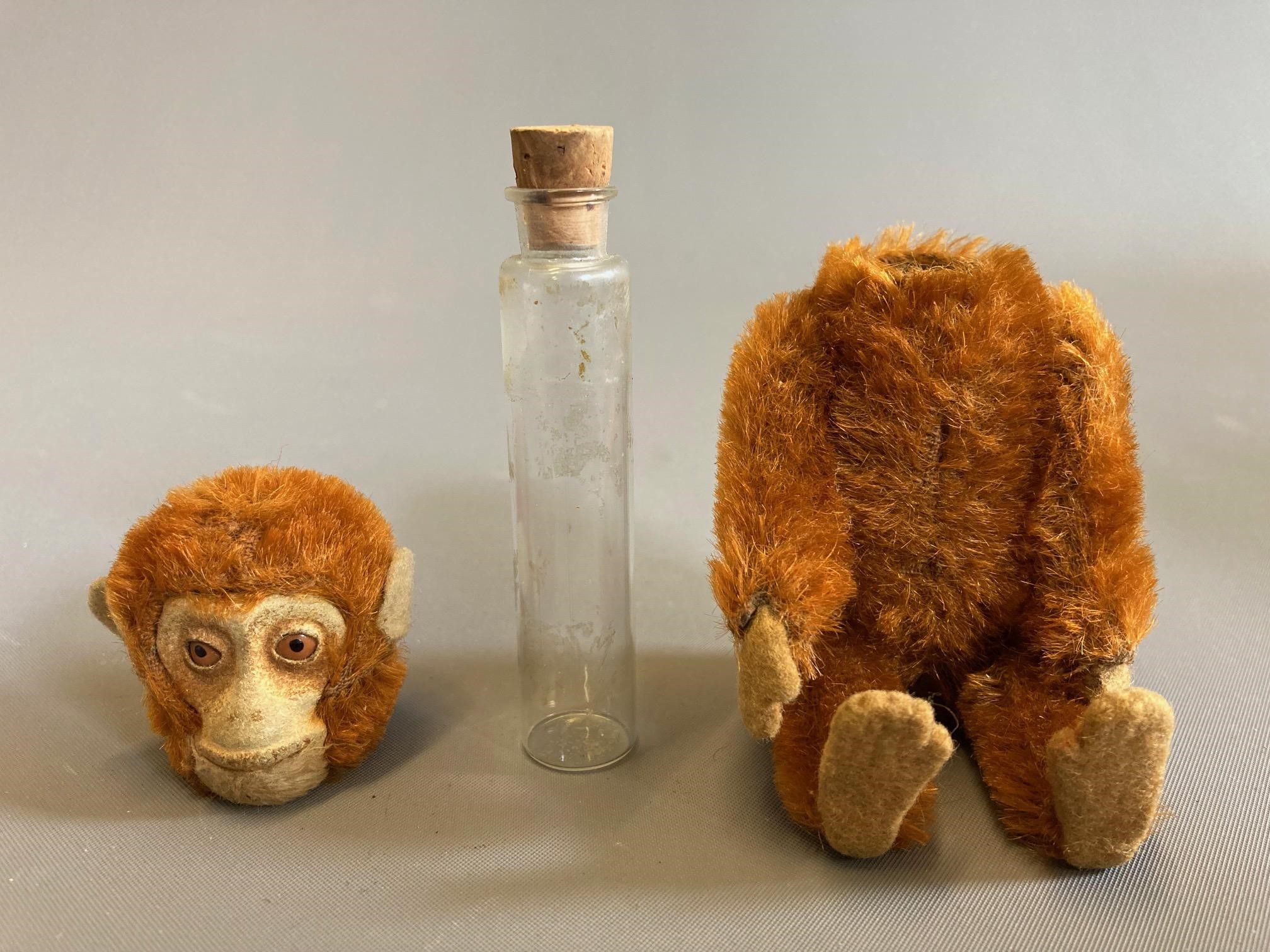 A Schuco plush monkey scent bottle with removable head and internal glass vial, with felt face, Image