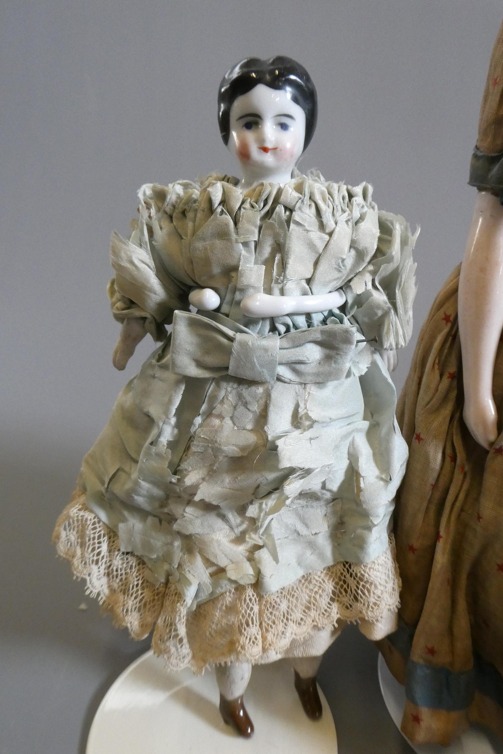 Three Victorian china shoulder head dolls Image