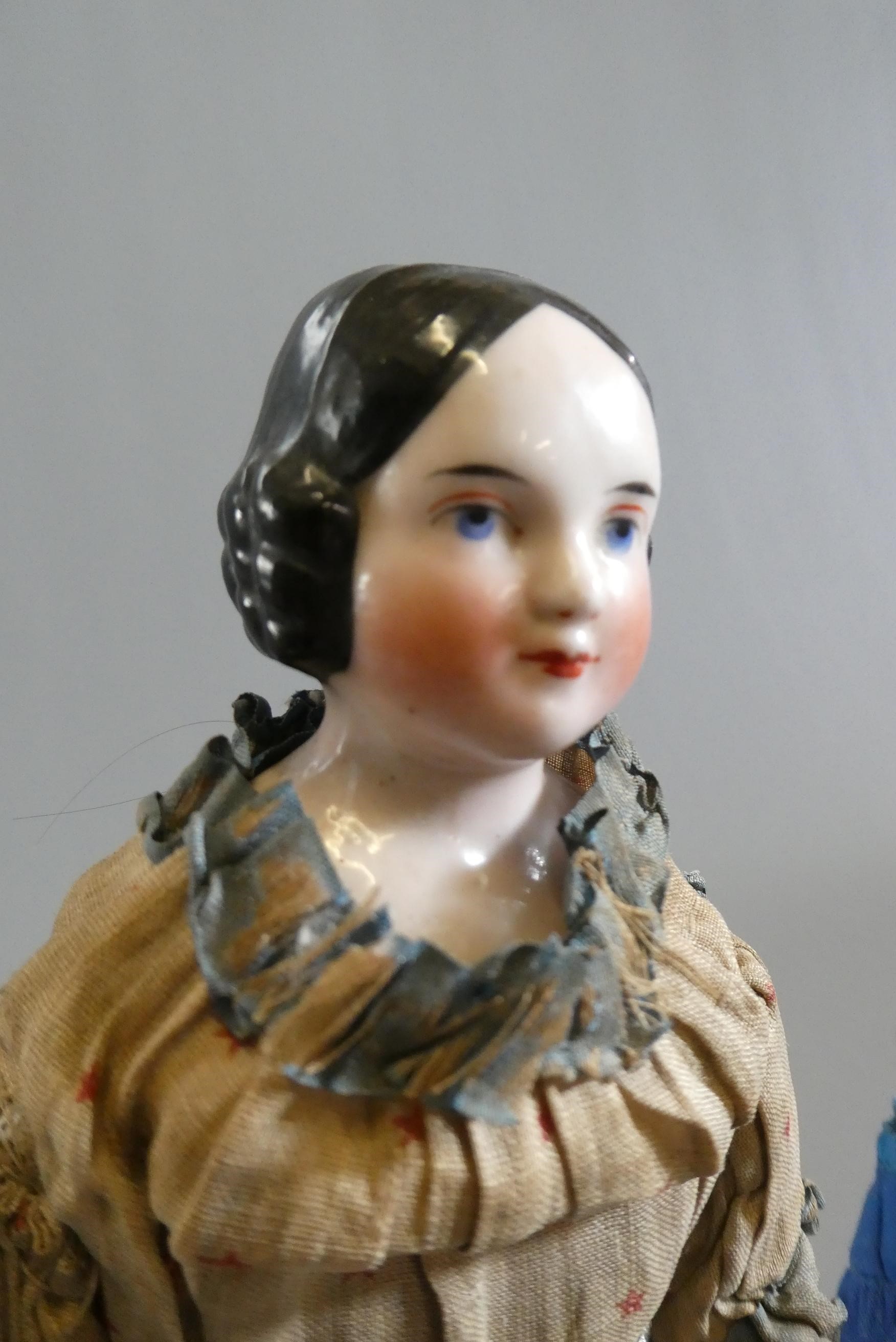 Three Victorian china shoulder head dolls Image