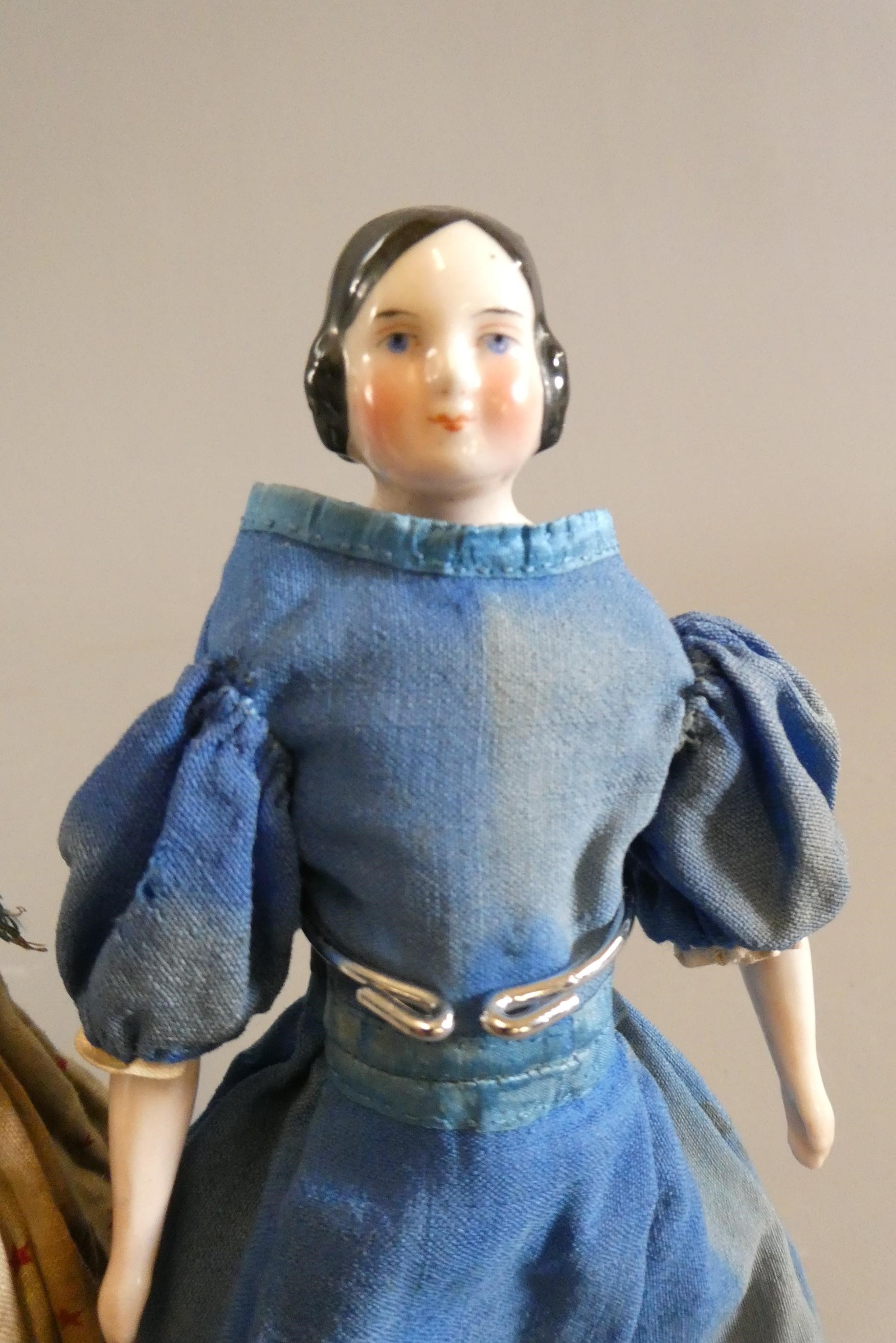 Three Victorian china shoulder head dolls Image
