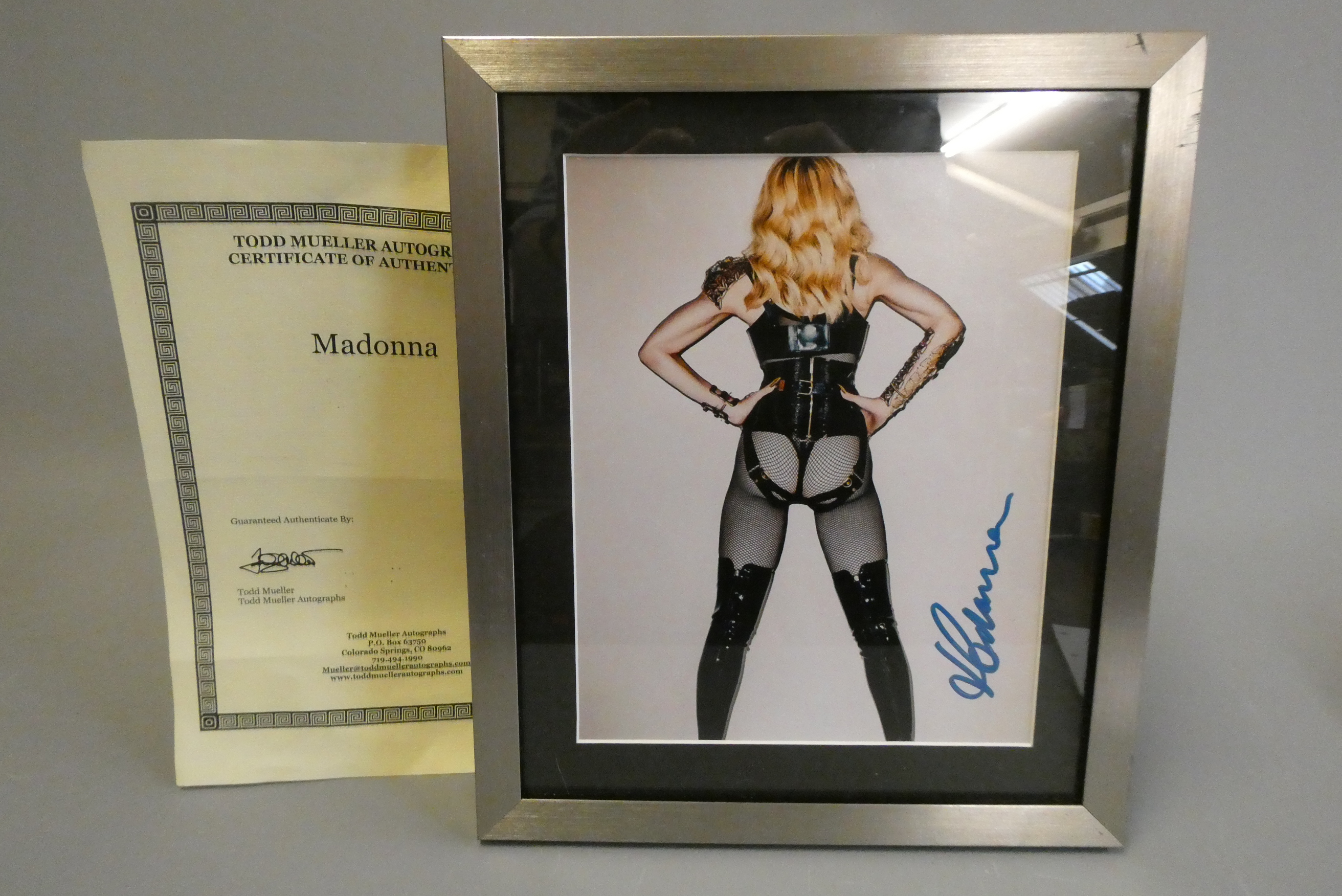 Signed photograph of Madonna, framed, with Todd Mueller certificate (Est. plus 24% buyer's premium Image