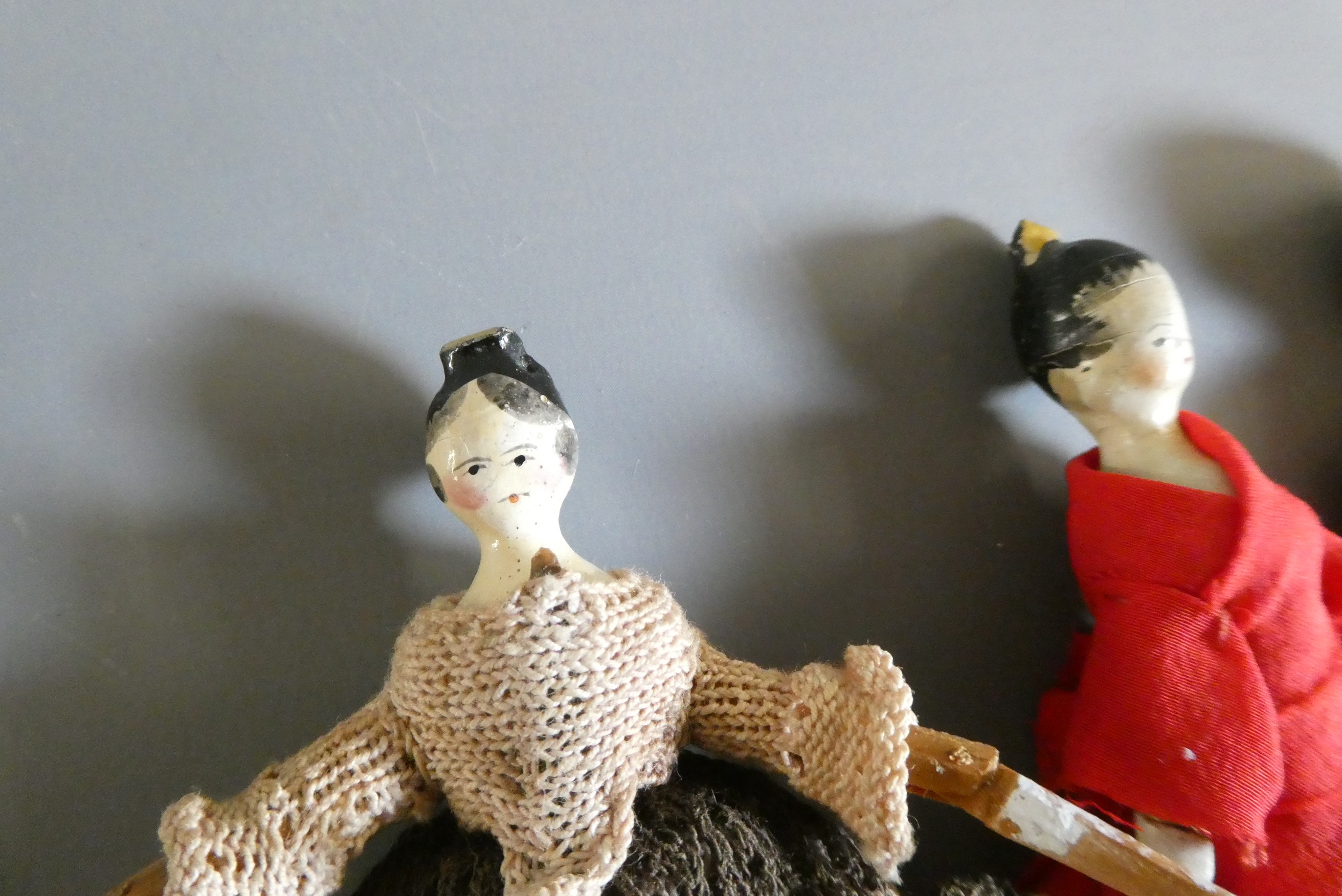 Three small peg dolls Image