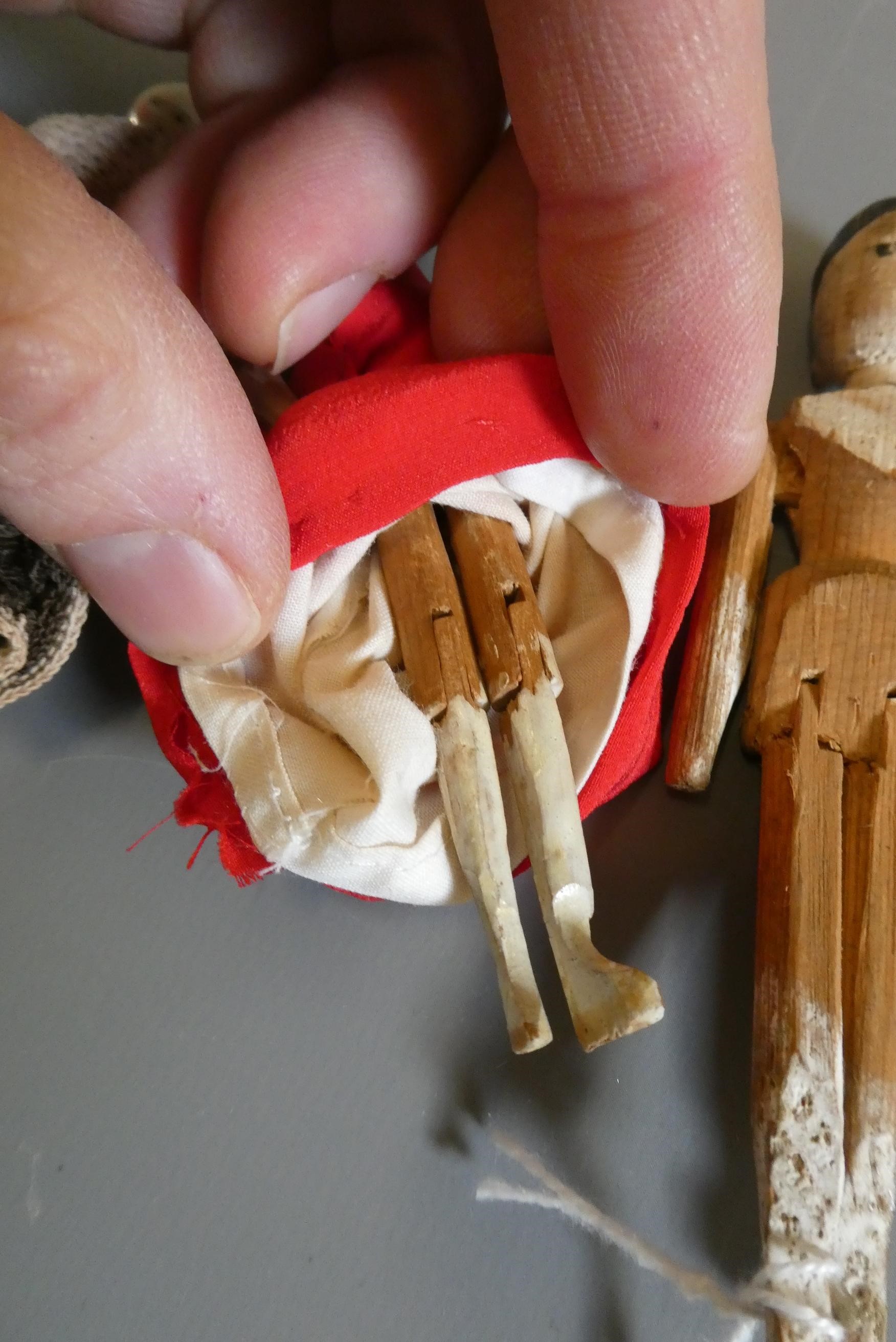 Three small peg dolls Image