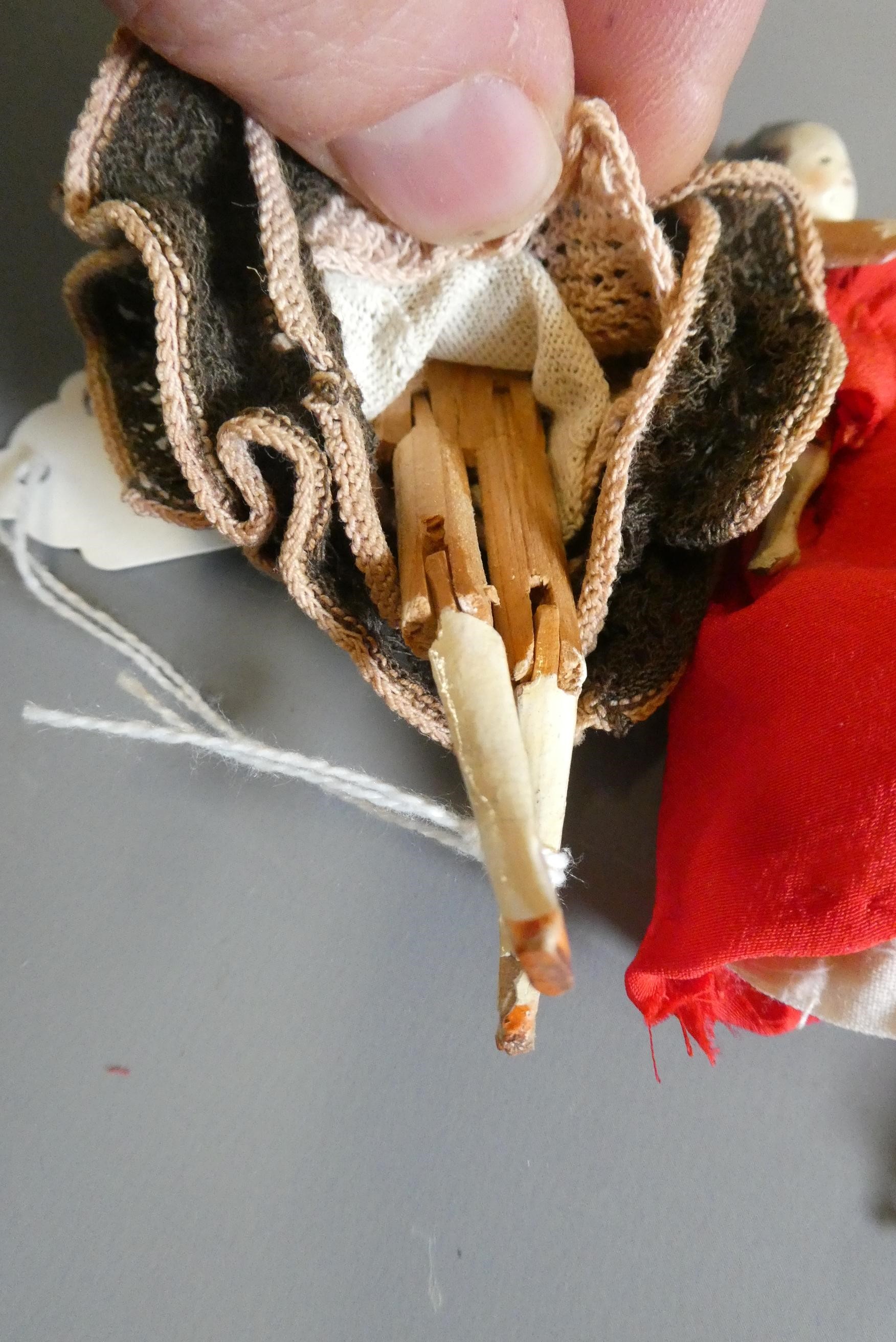 Three small peg dolls Image