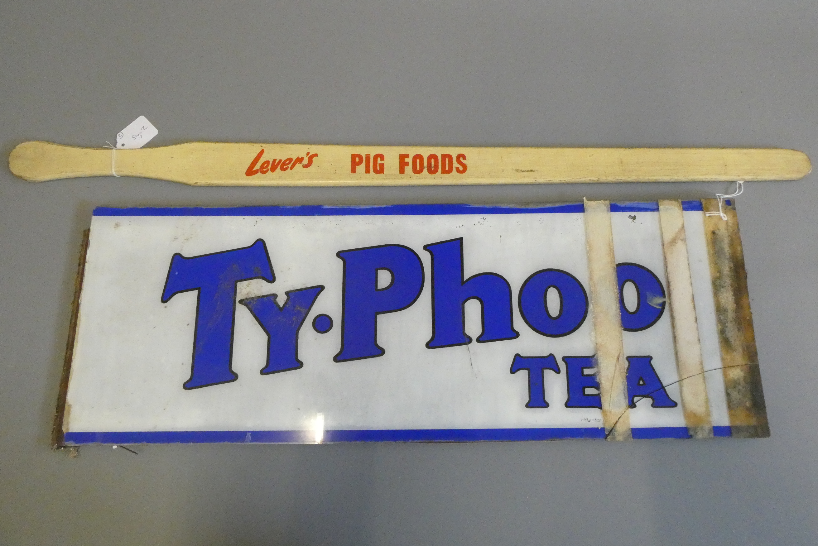 A Lever's "PIG FOODS" advertising pig guiding stick, 36" long, together with a glass Ty-Phoo tea Image