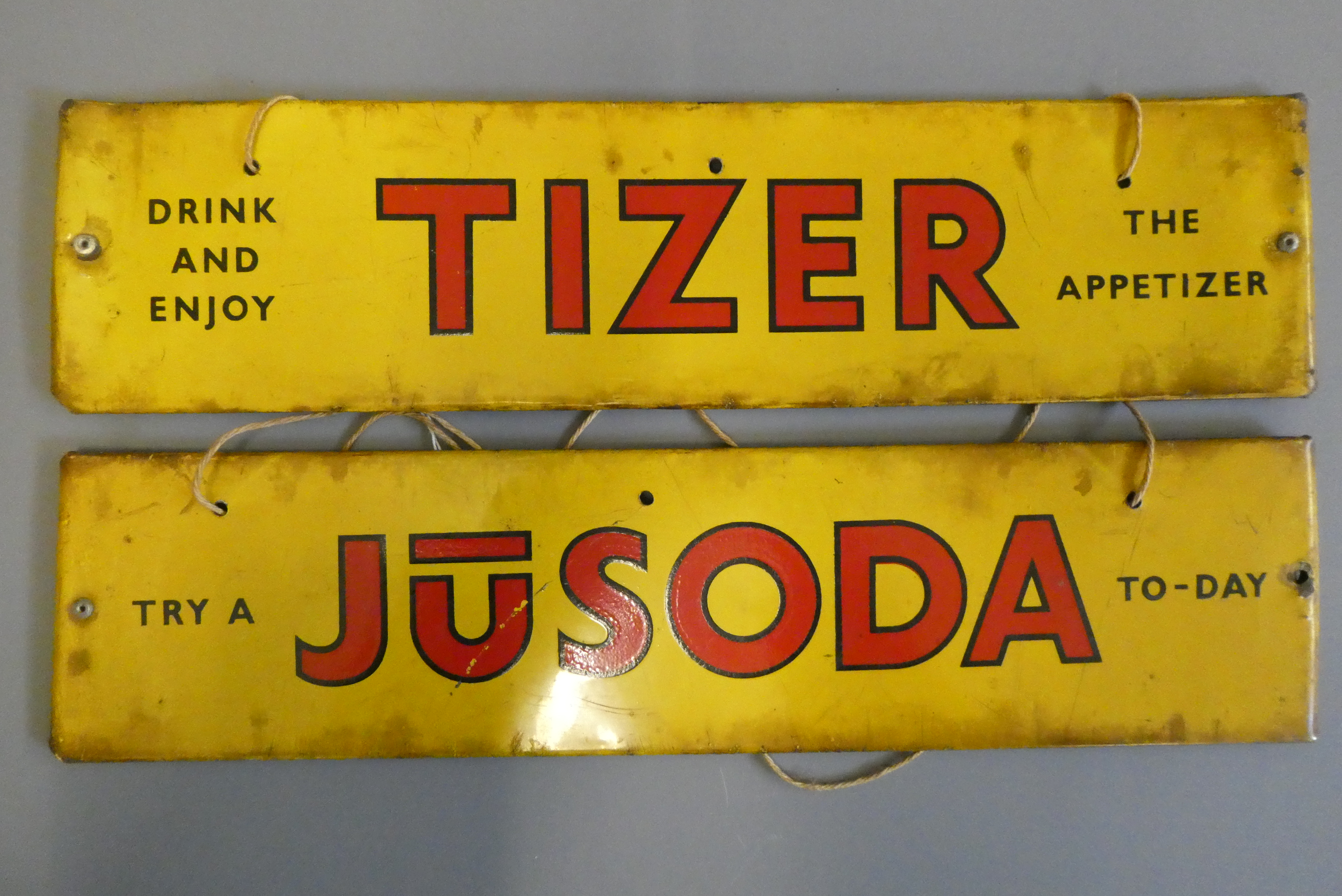 Two tin advertising signs, for TIZER and JUSODA, both 14 3/4" (Est. plus 24% buyer's premium inc. Image