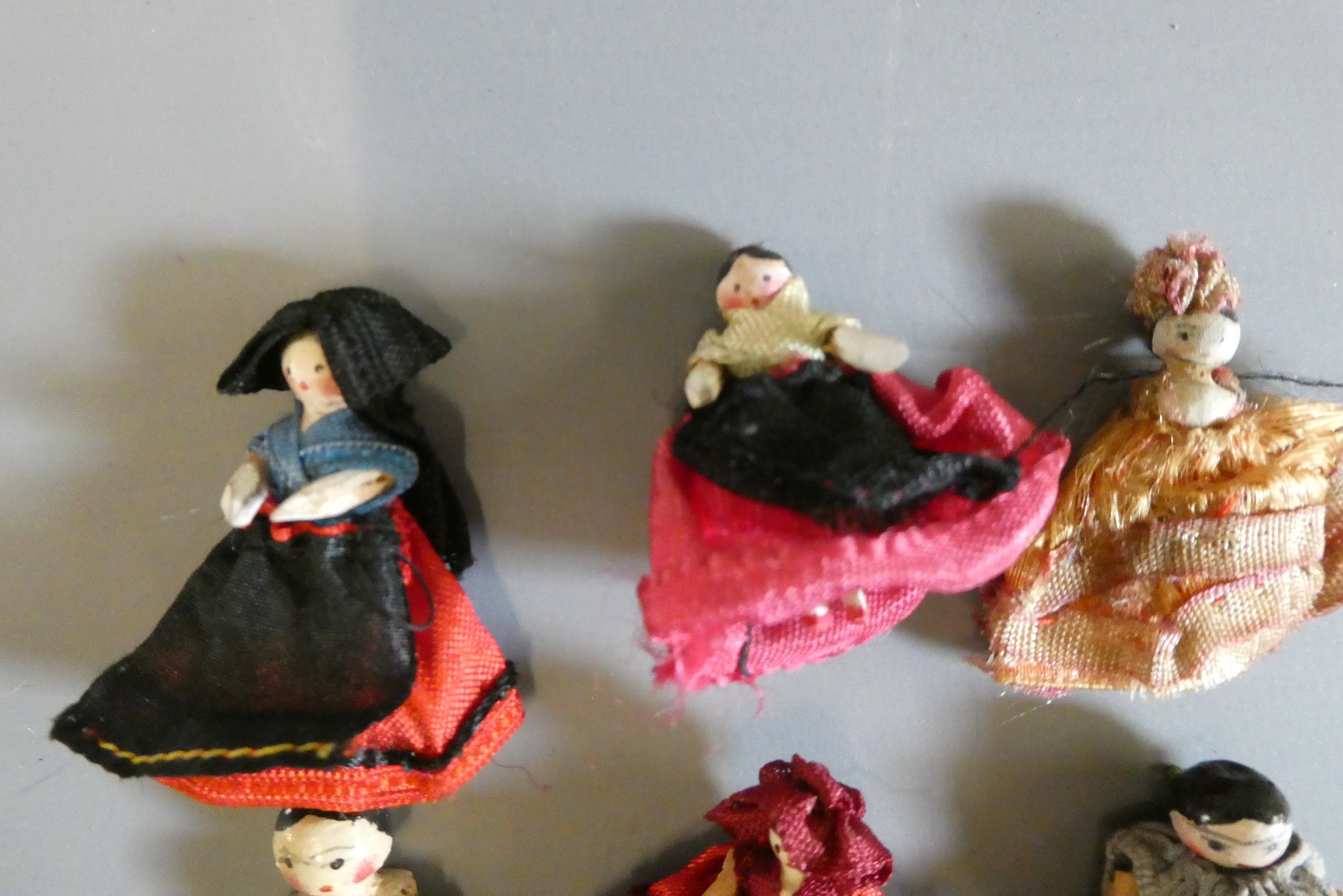 Six miniature doll's house peg dolls, all wood construction with painted features and jointed Image