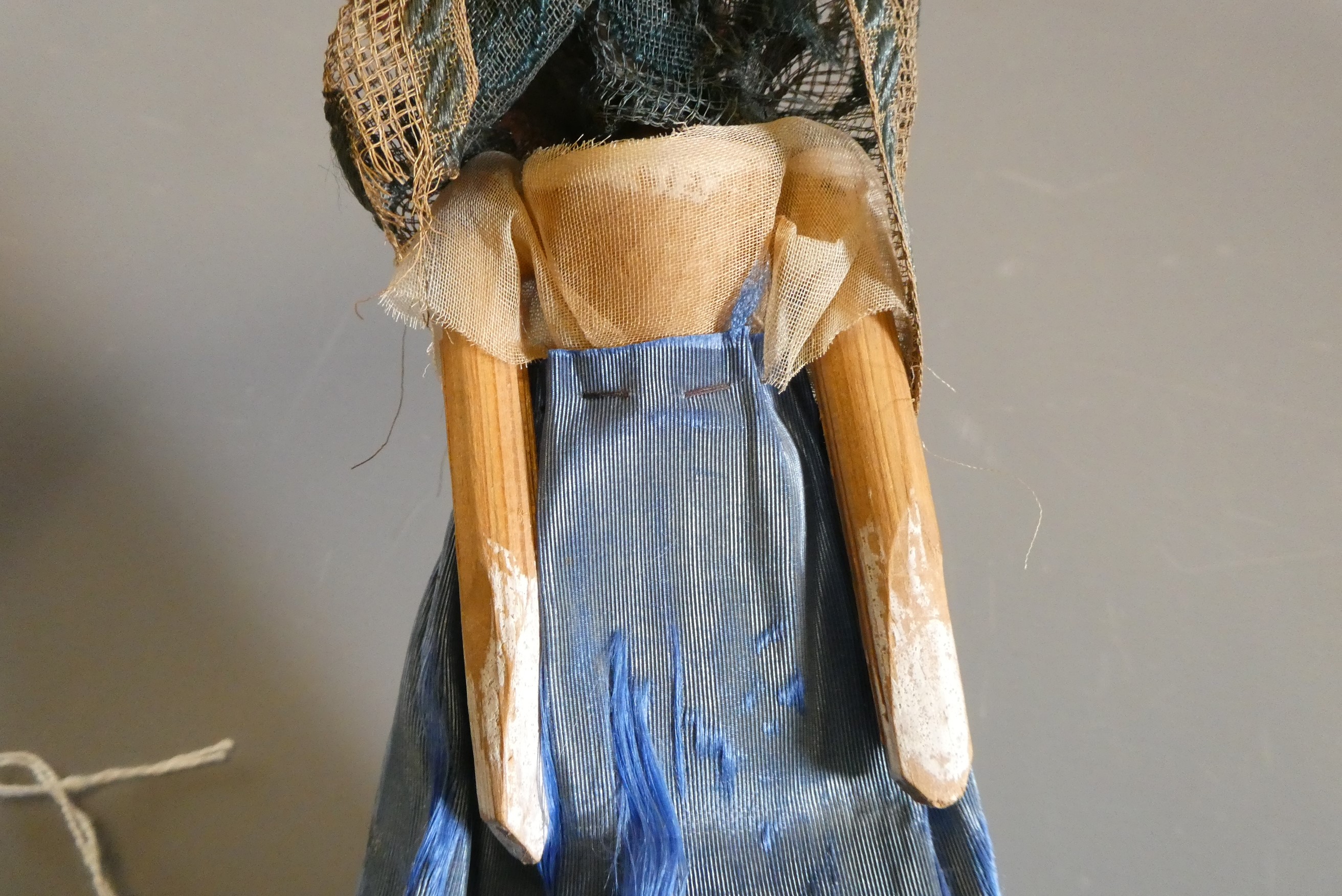 A Victorian peg doll of carved would construction, with painted features, jointed shoulders and Image