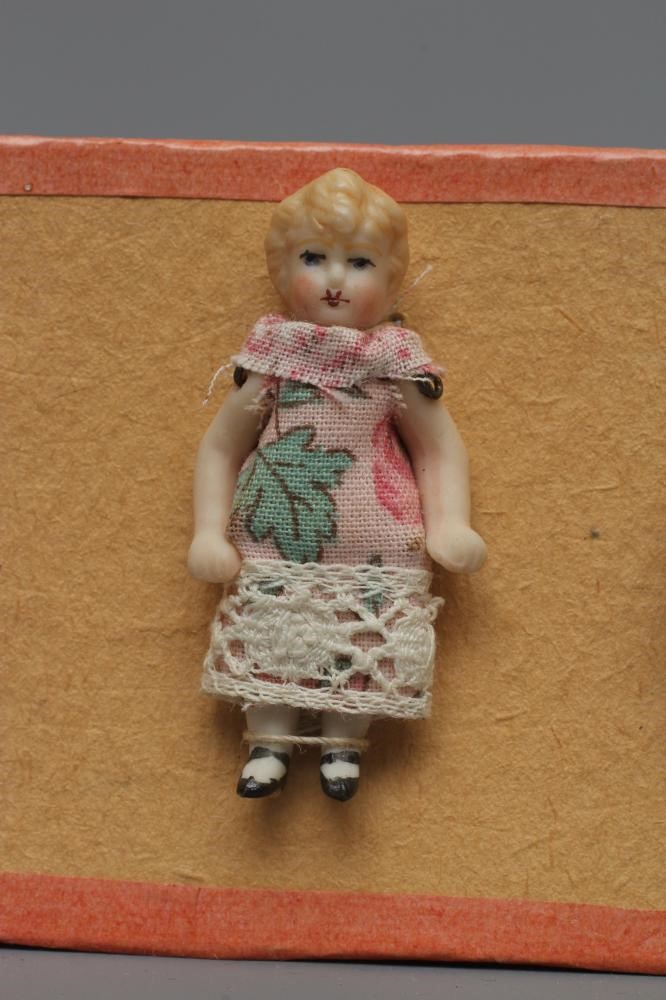 Six Hertwig & Co. all bisque doll's house dolls with moulded and painted features Image