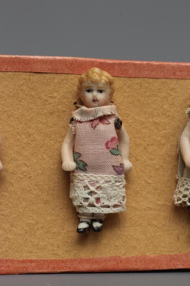 Six Hertwig & Co. all bisque doll's house dolls with moulded and painted features Image