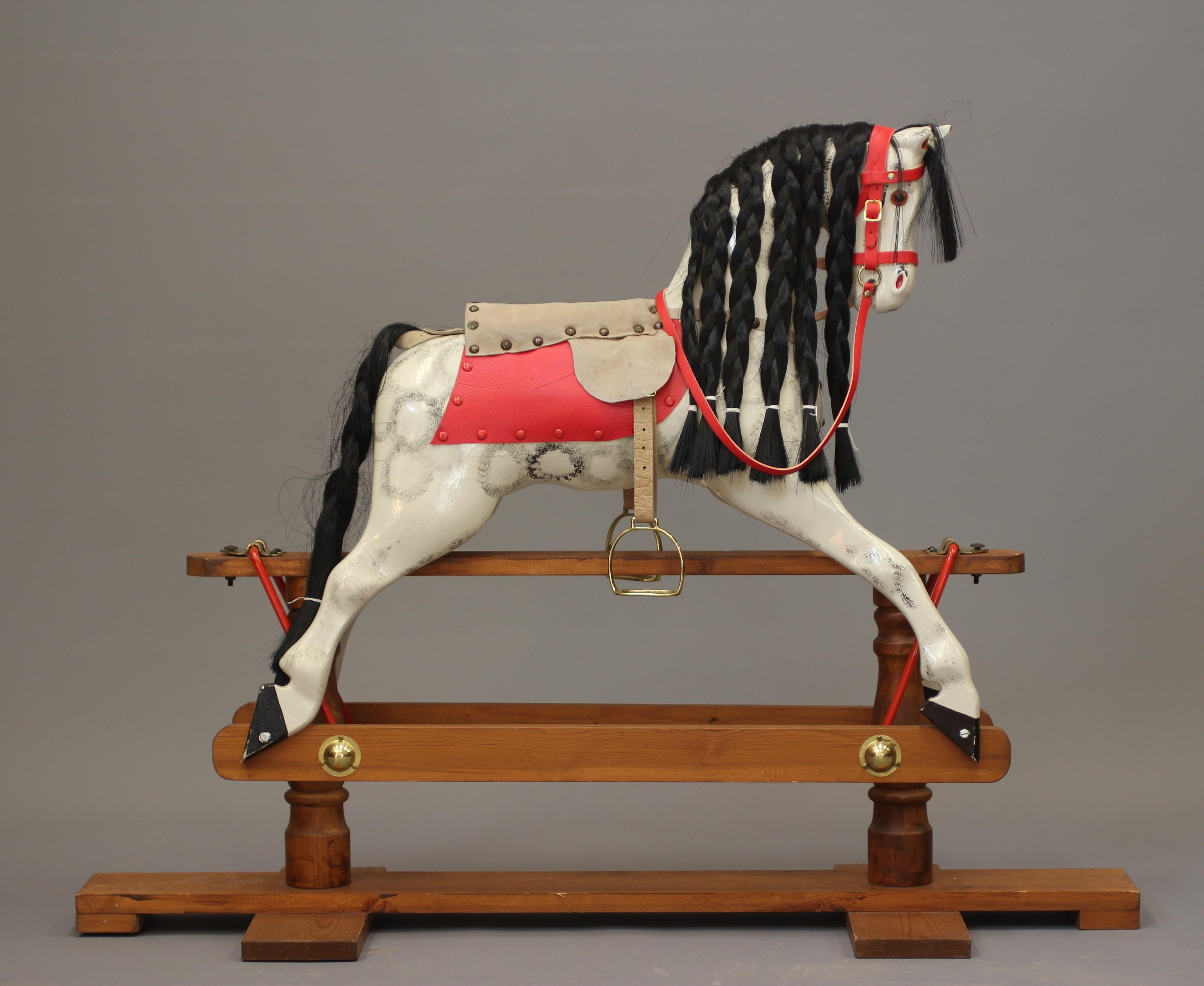 A vintage wood carved rocking horse Image