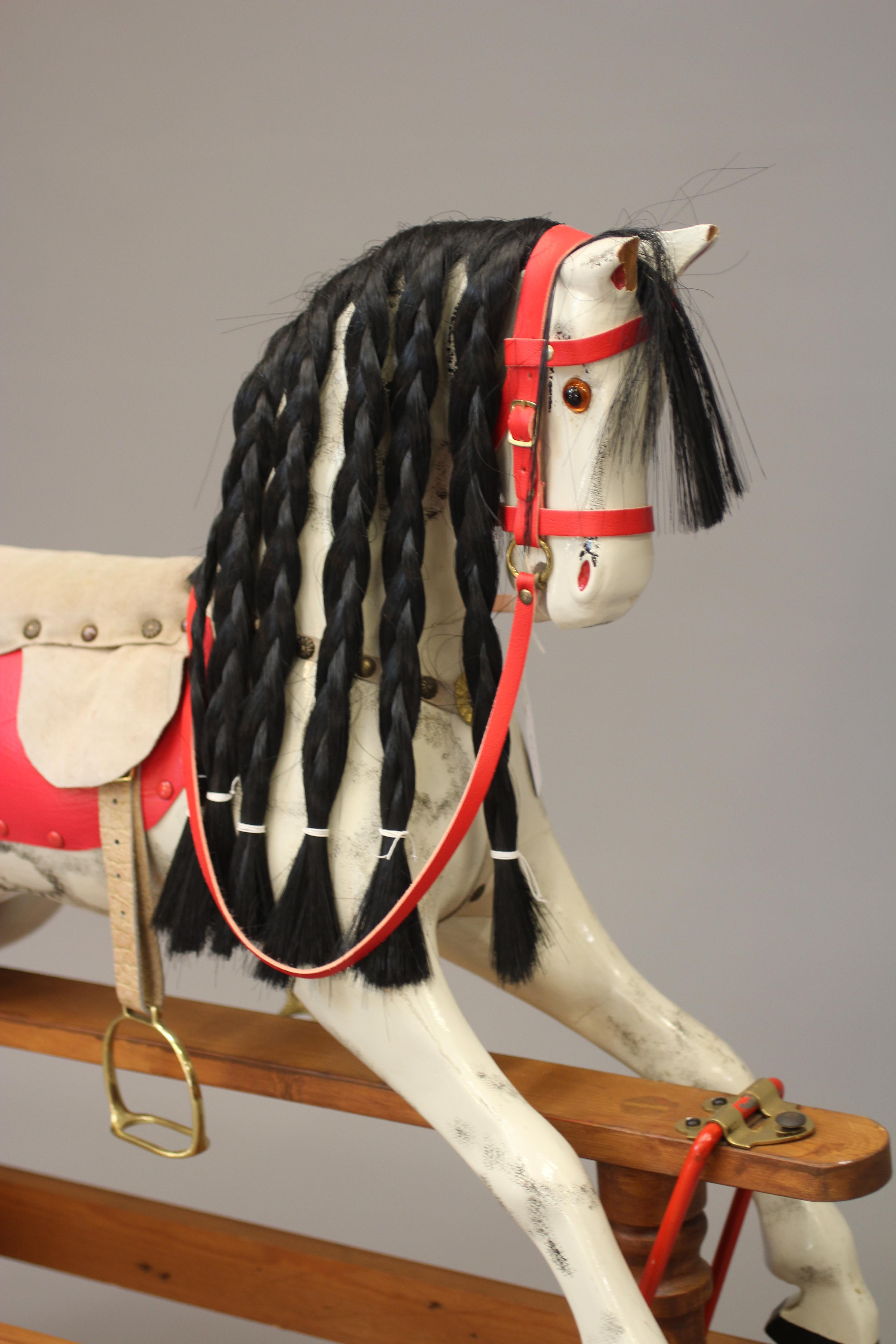 A vintage wood carved rocking horse Image