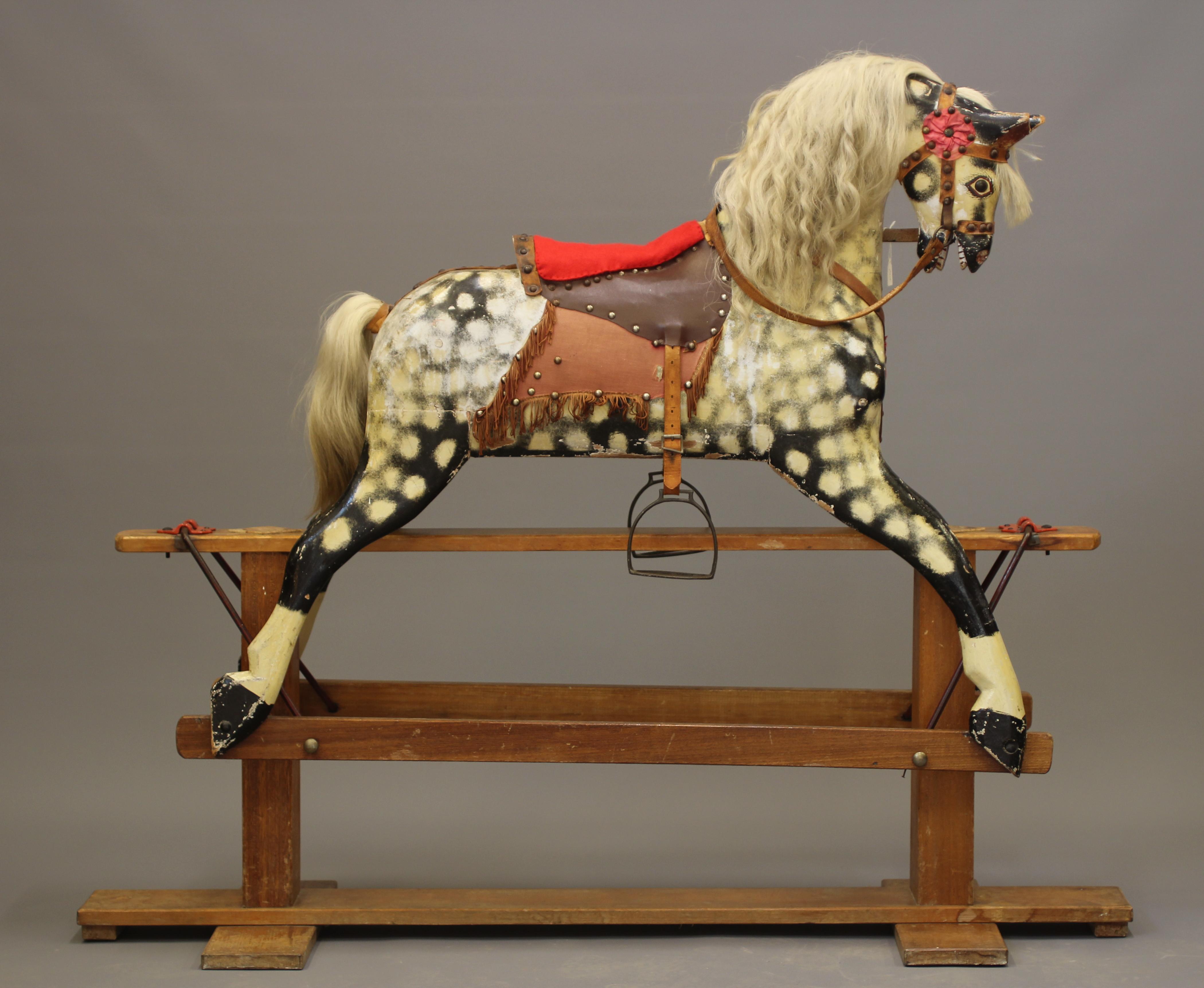 A wood carved rocking horse Image