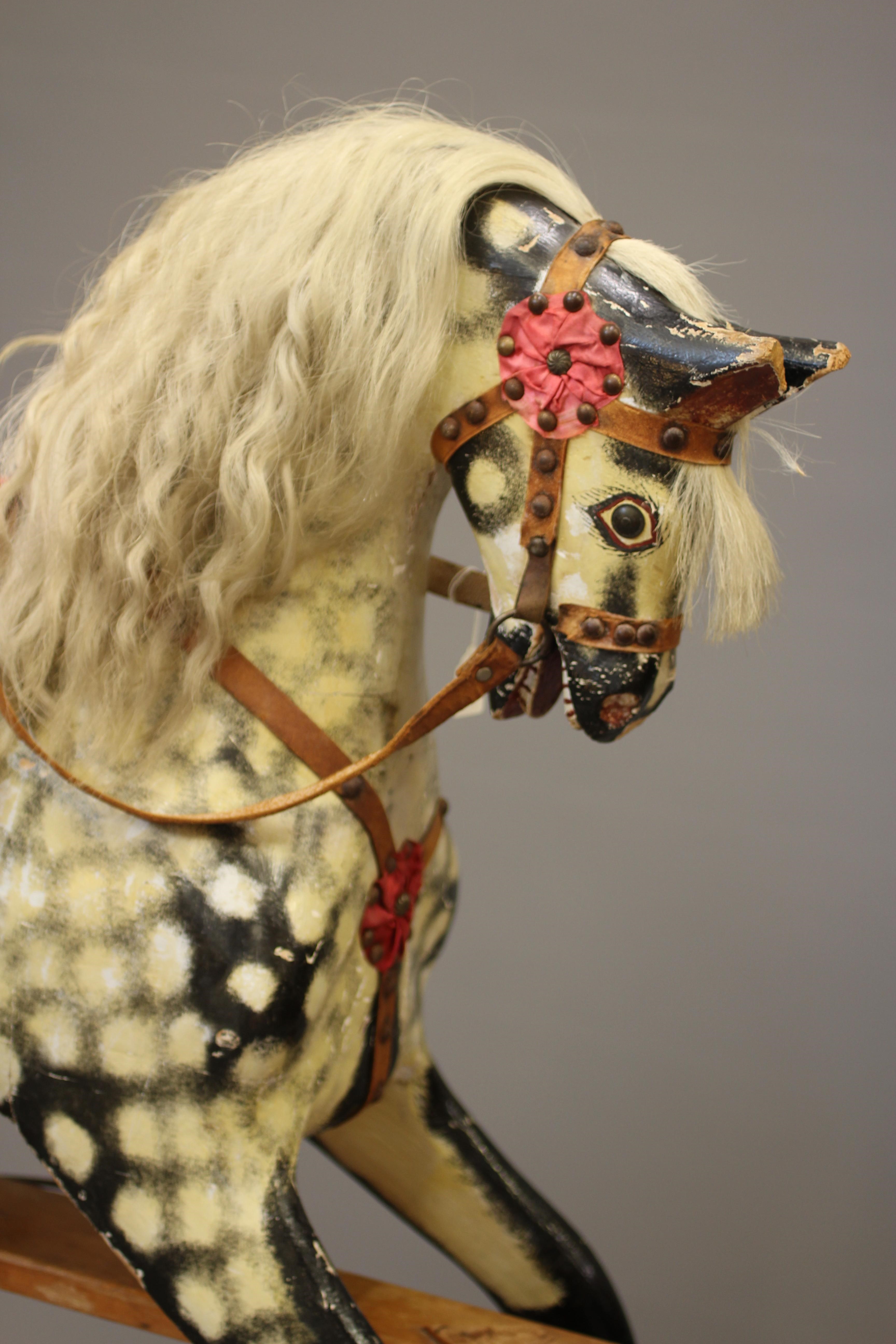 A wood carved rocking horse Image