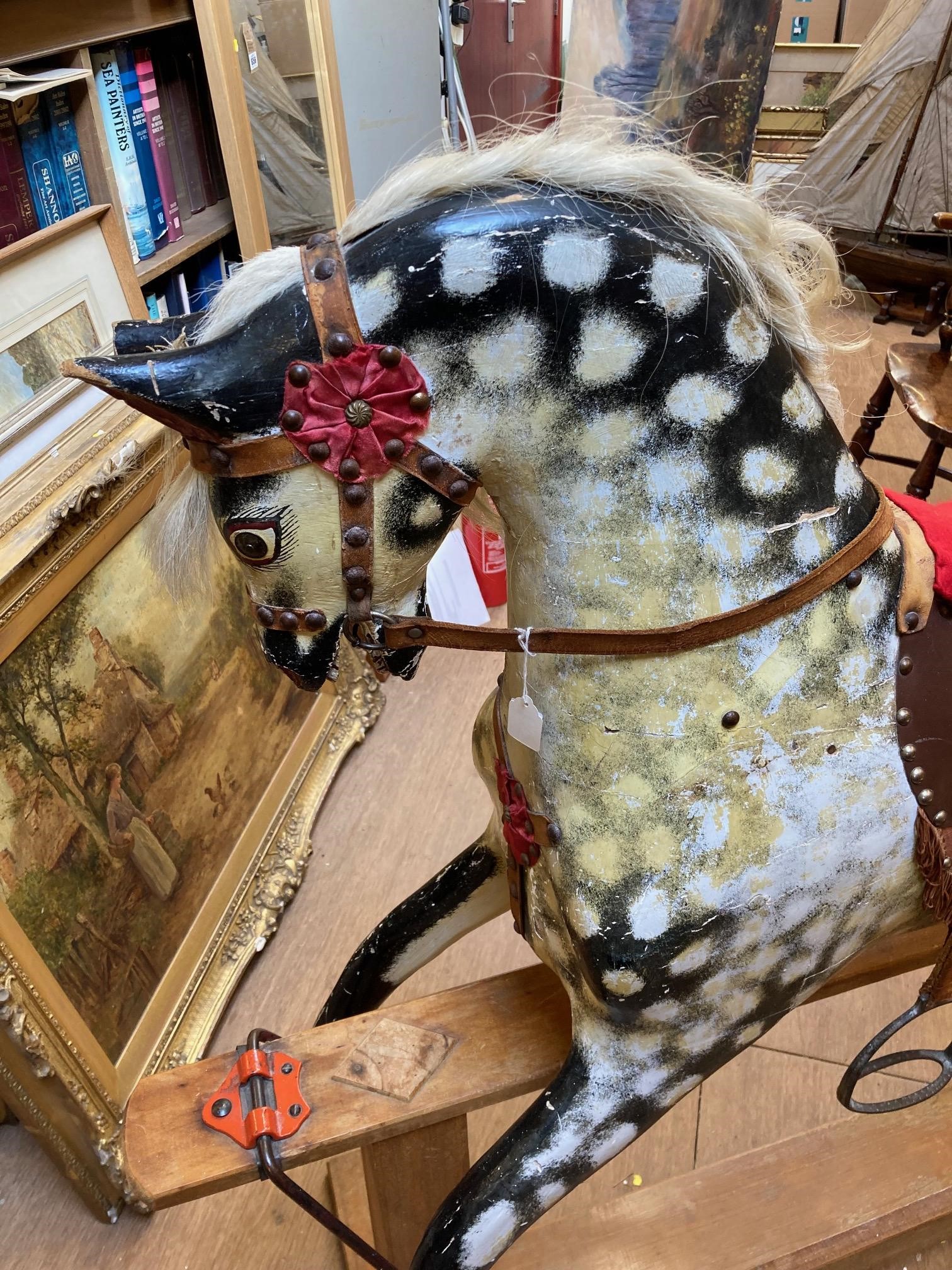 A wood carved rocking horse Image