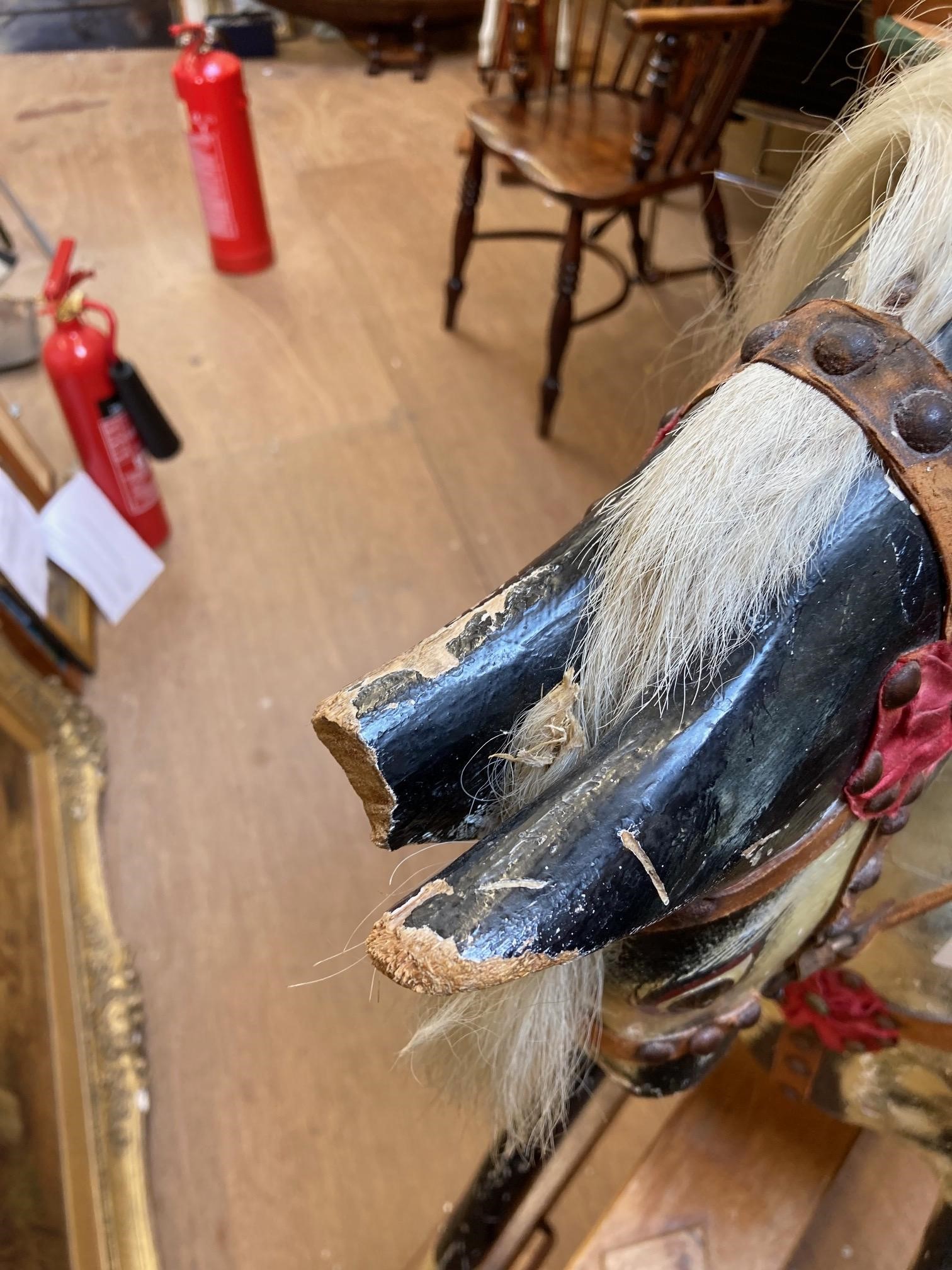 A wood carved rocking horse Image