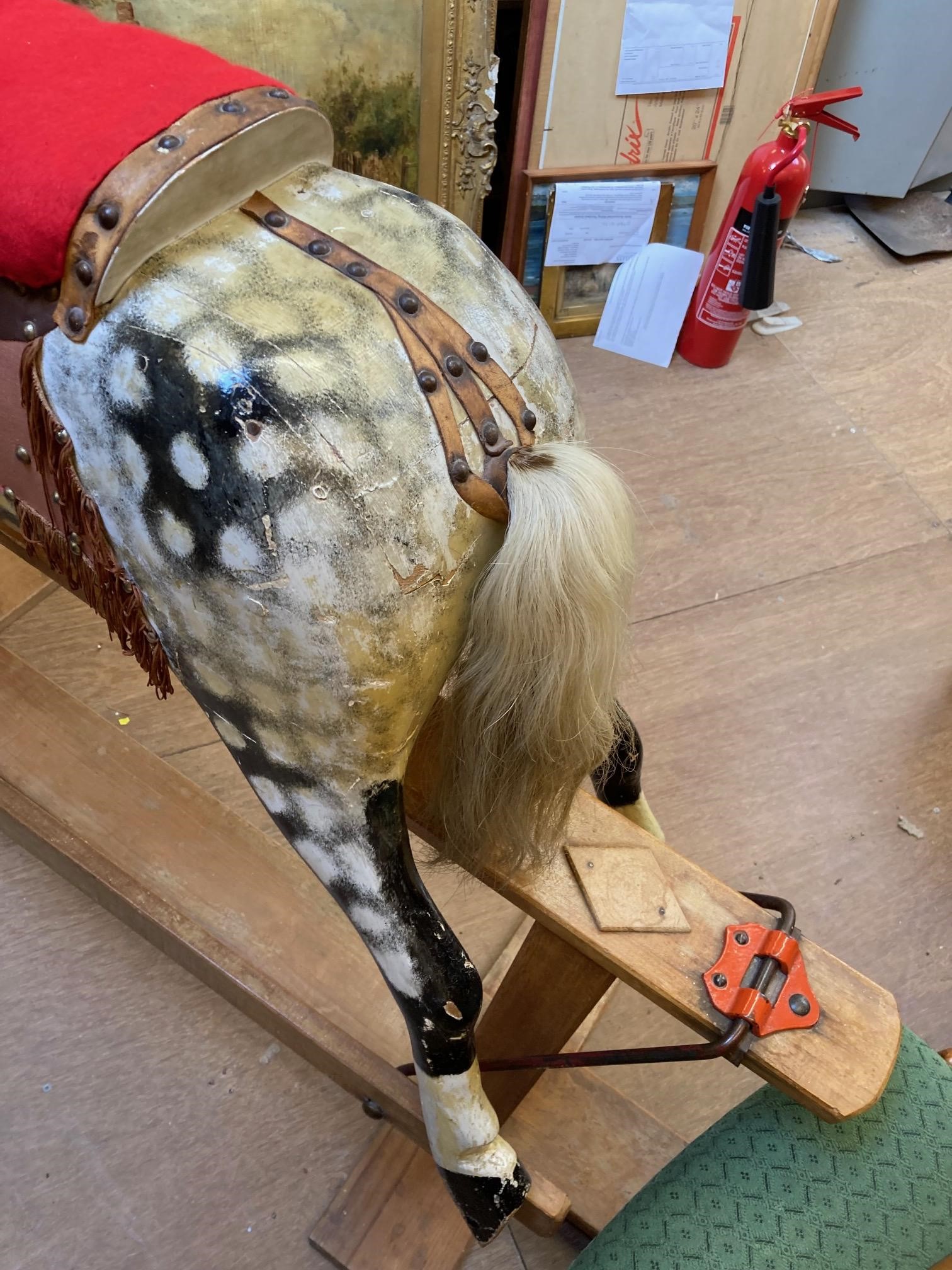A wood carved rocking horse Image