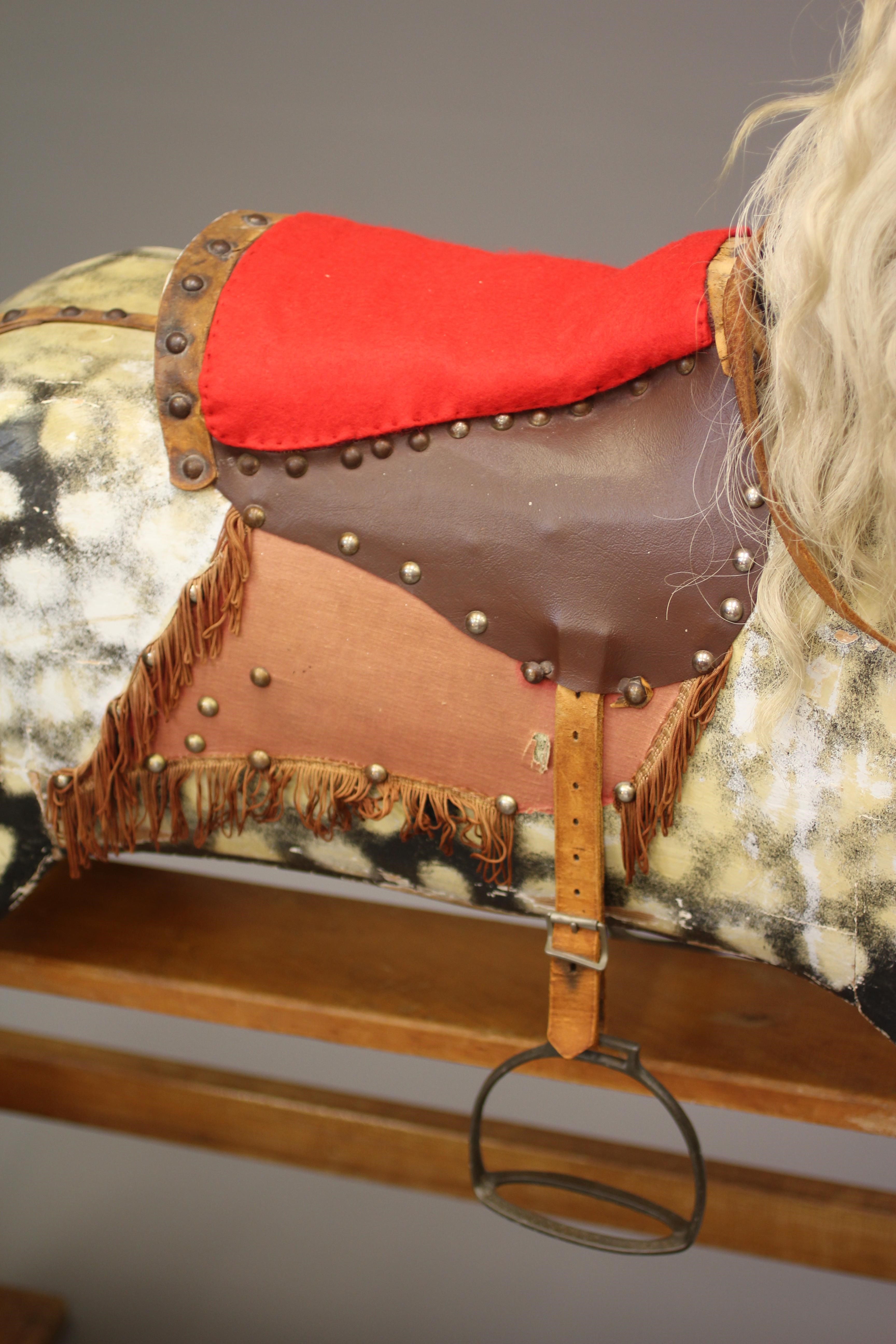 A wood carved rocking horse Image
