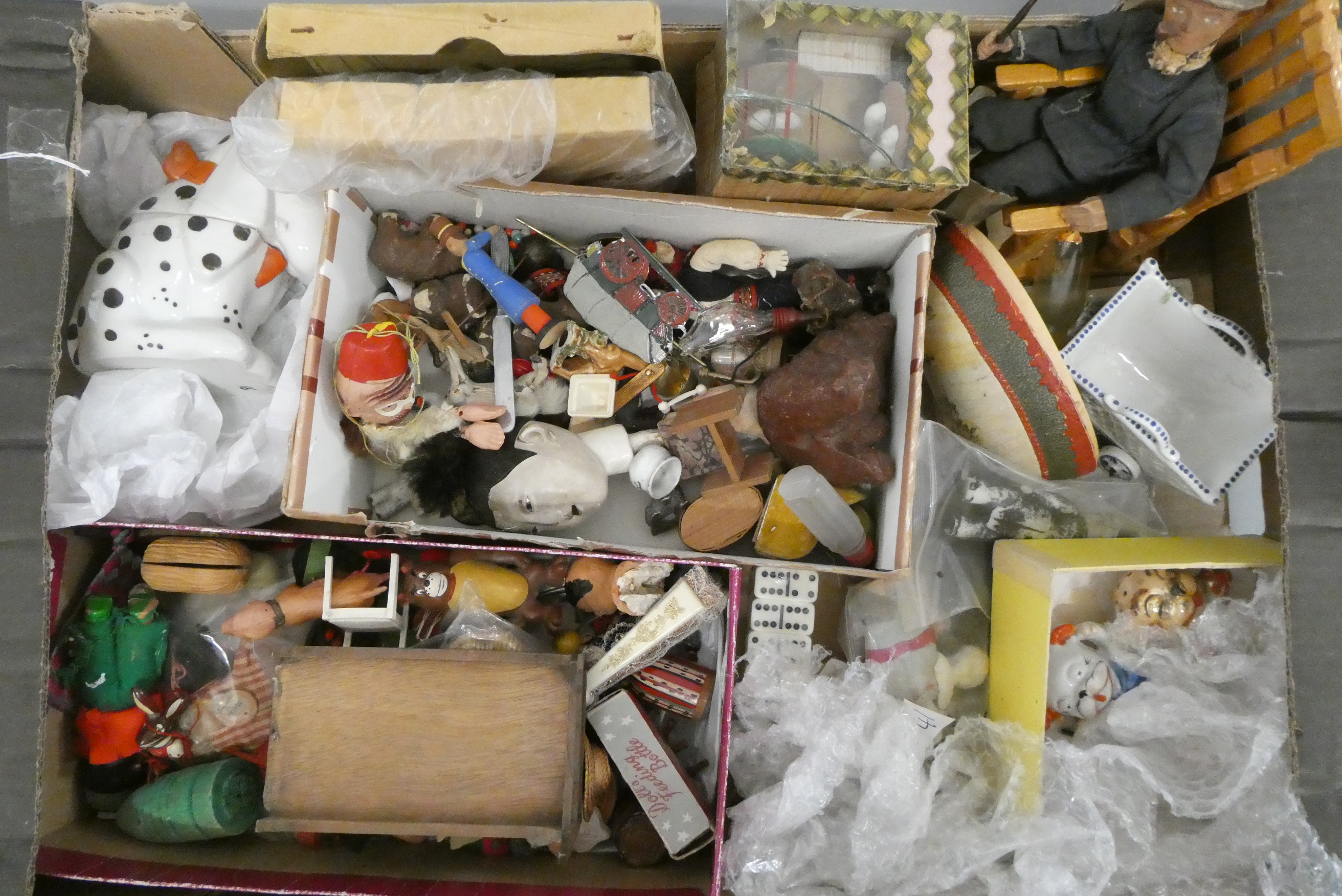 A boxed filled with vintage and antique toys, including Bonzo salt and pepper, Dismal Desmond pot, a Image