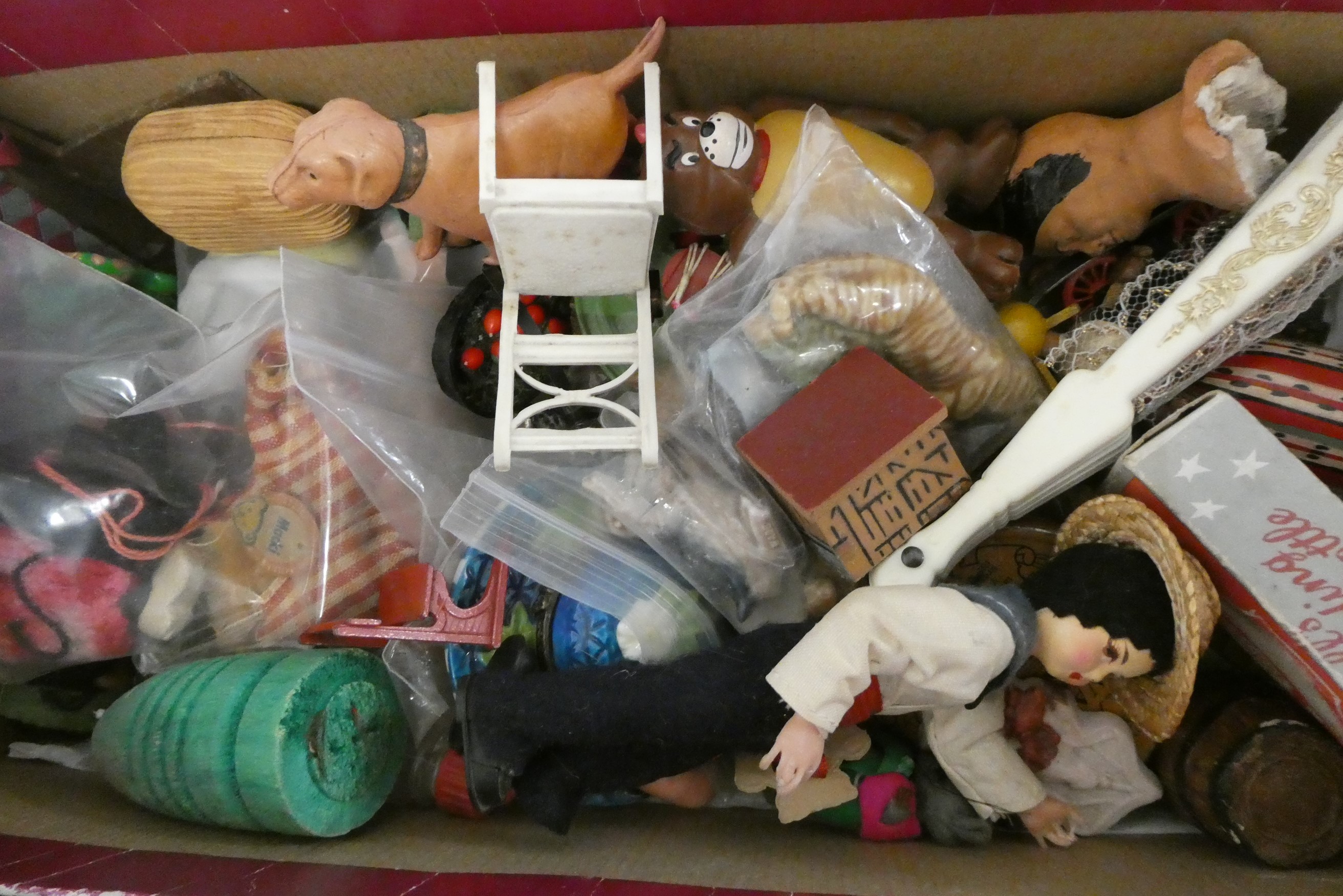 A boxed filled with vintage and antique toys, including Bonzo salt and pepper, Dismal Desmond pot, a Image