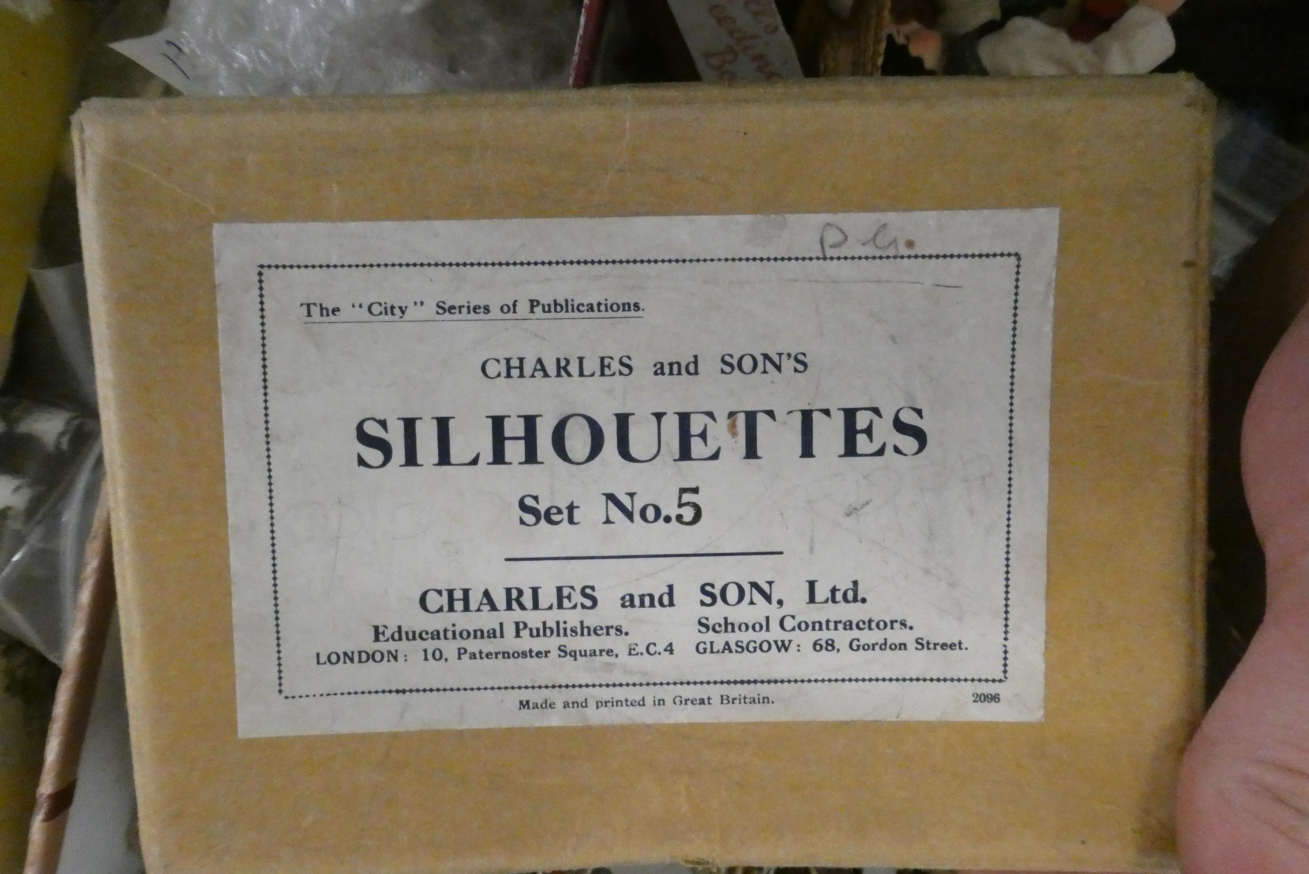 A boxed filled with vintage and antique toys, including Bonzo salt and pepper, Dismal Desmond pot, a Image