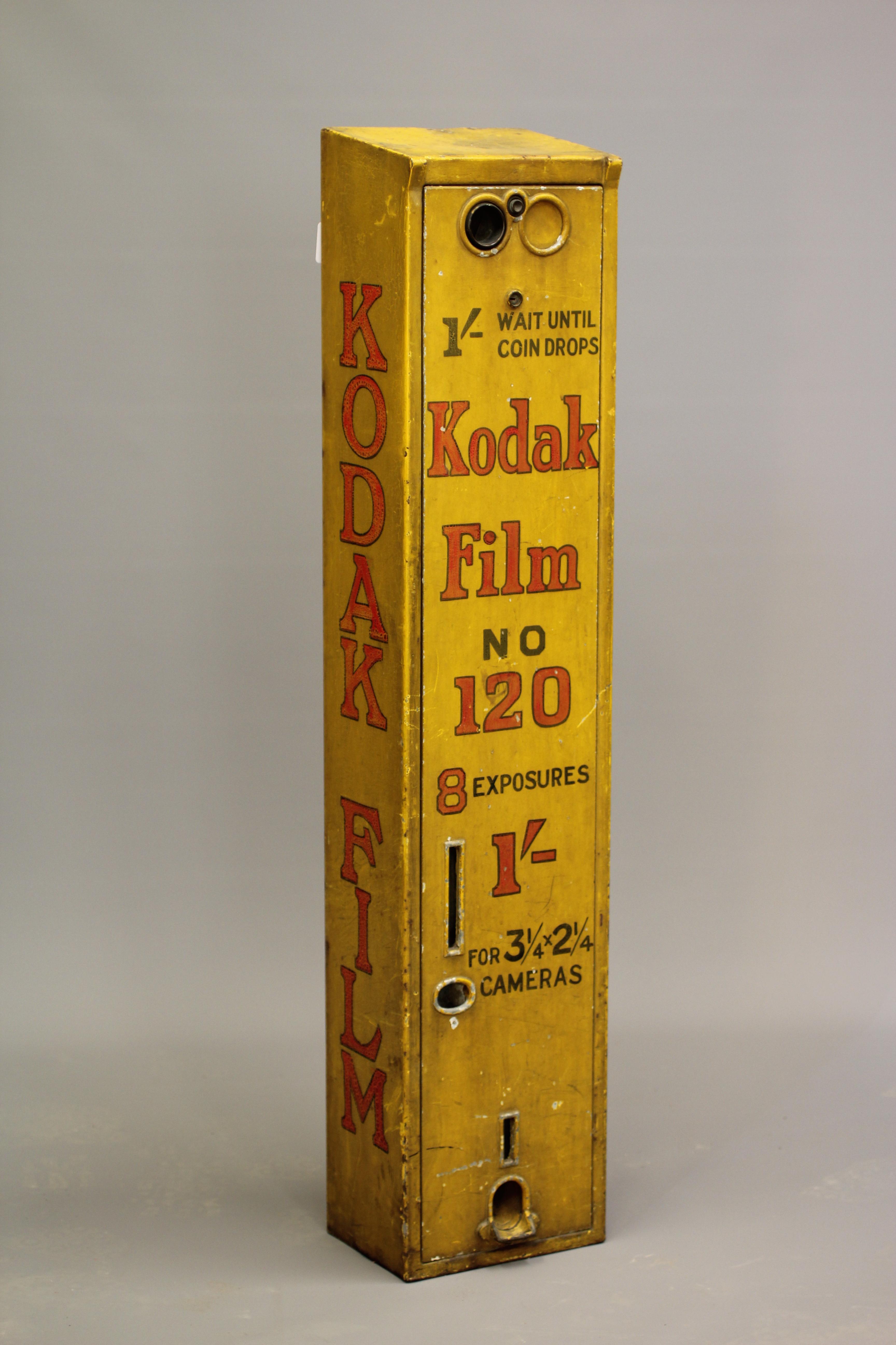 A Kodak film dispenser, 1940s, of metal construction painted yellow with red script, priced at 1/-, Image