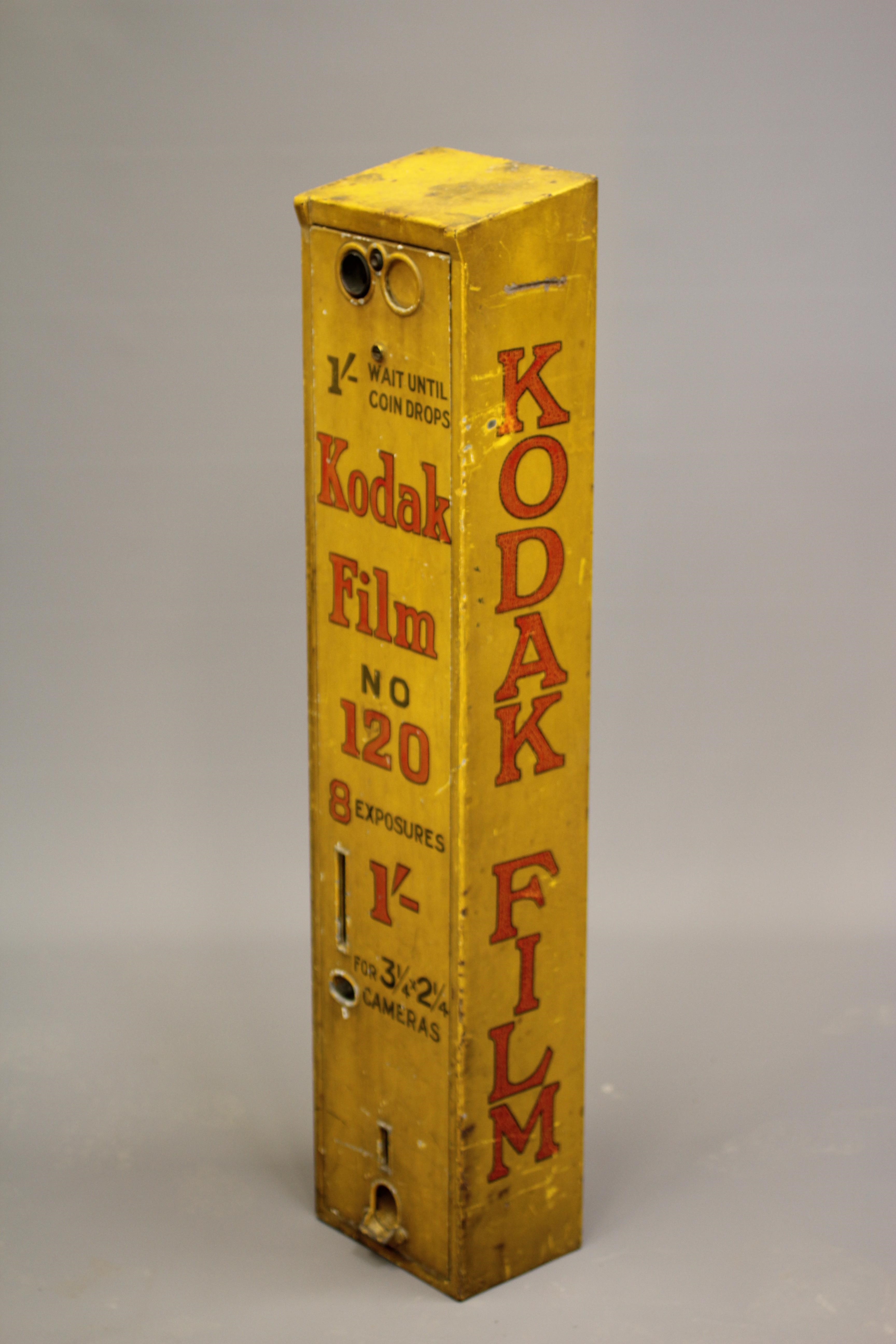 A Kodak film dispenser, 1940s, of metal construction painted yellow with red script, priced at 1/-, Image