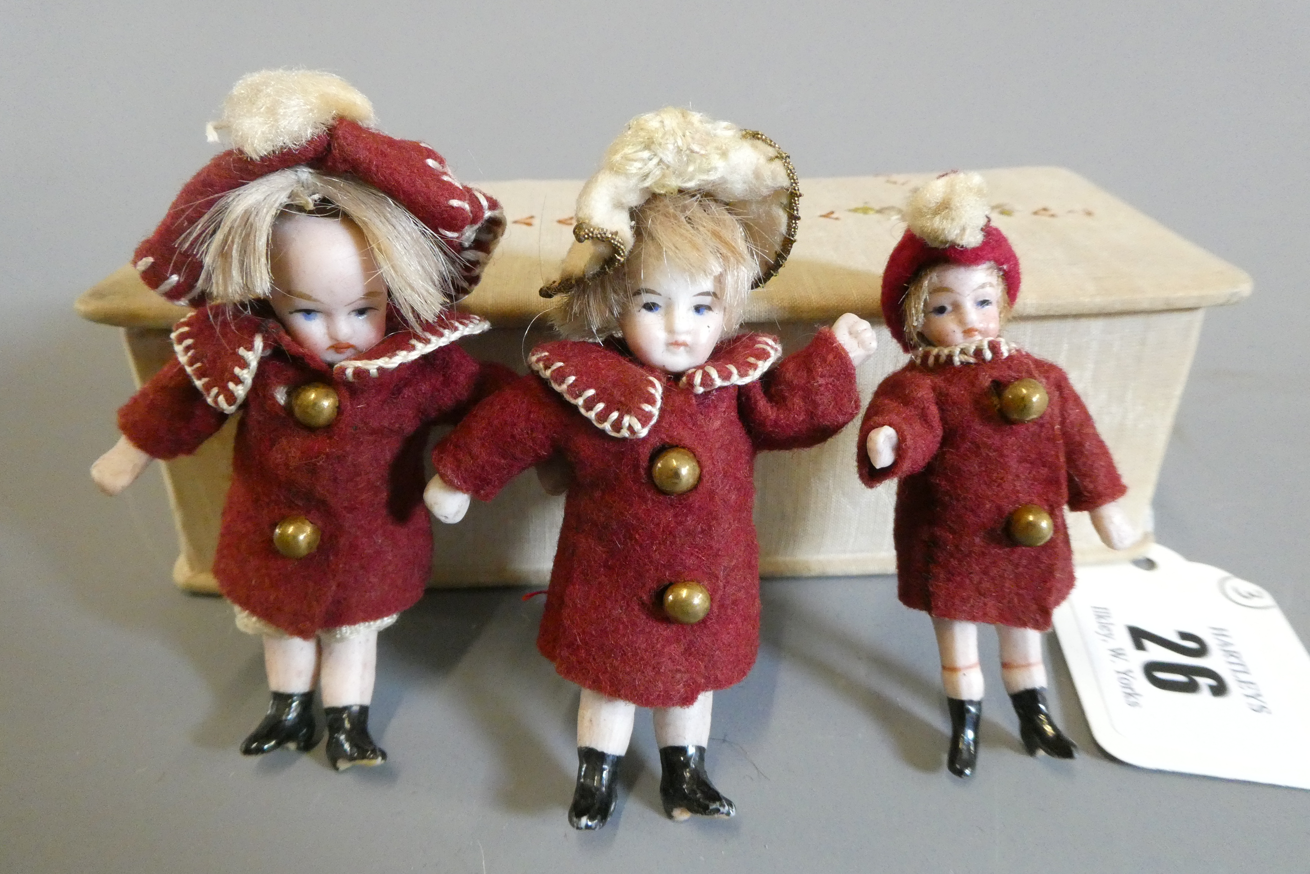 A pair of all bisque doll's house dolls with painted features and shoes Image