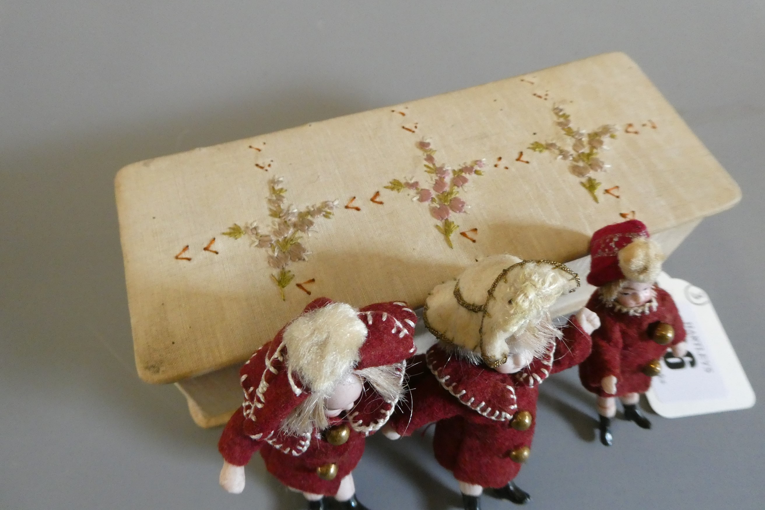 A pair of all bisque doll's house dolls with painted features and shoes Image