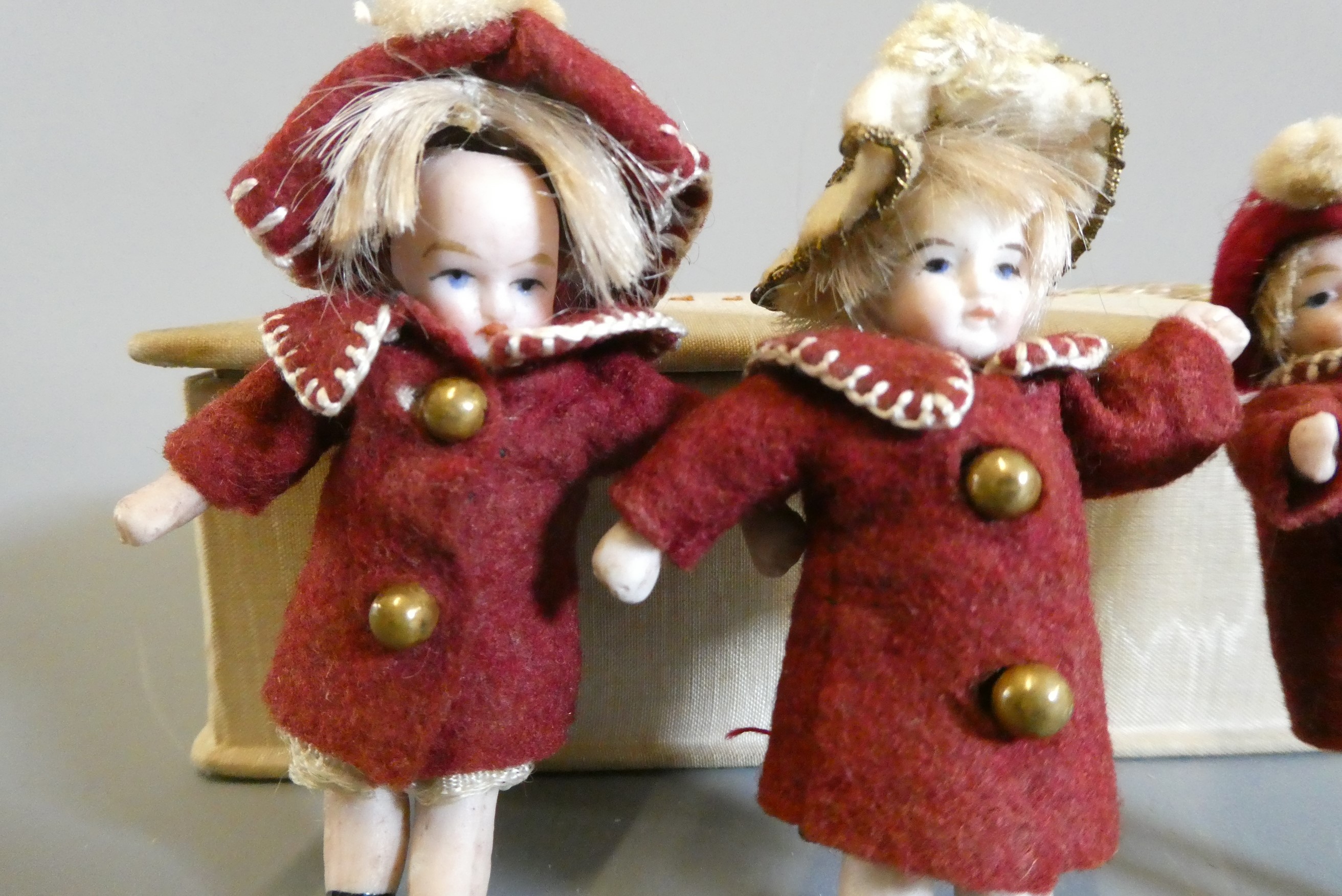 A pair of all bisque doll's house dolls with painted features and shoes Image