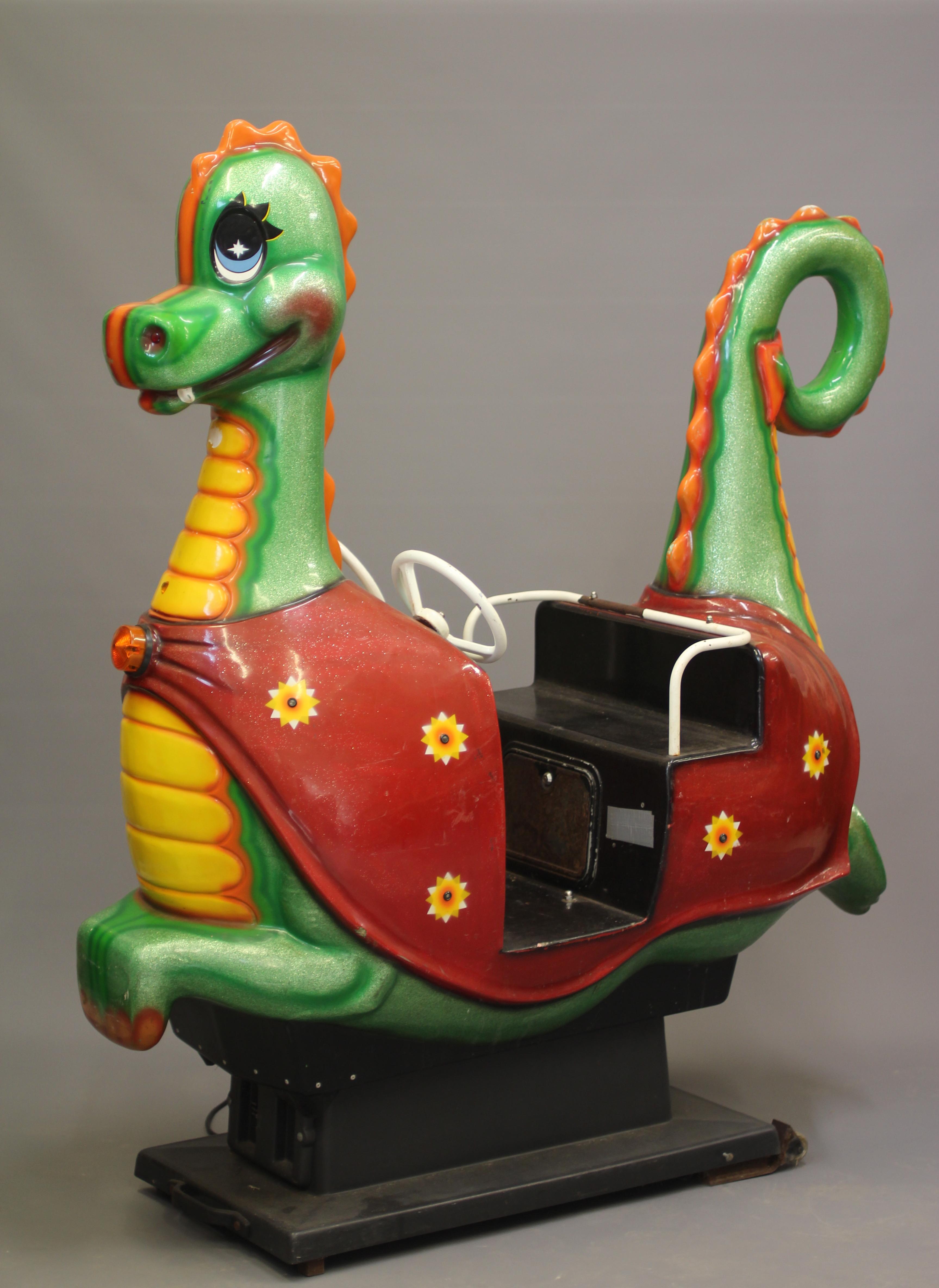 A Puff the Magic Dragon coin operated Whittaker Bros. kids ride, with 20p price, twin steering Image