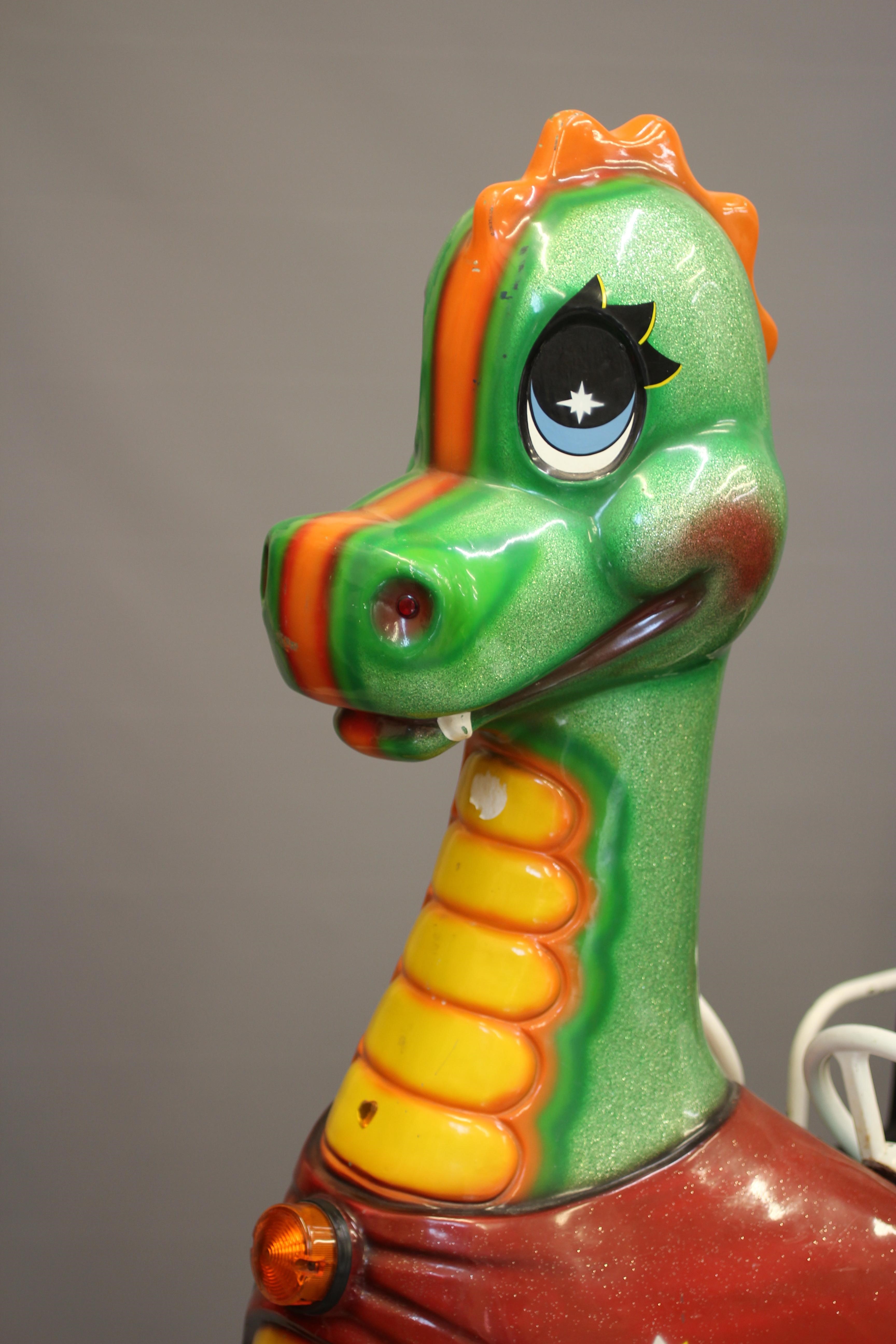 A Puff the Magic Dragon coin operated Whittaker Bros. kids ride, with 20p price, twin steering Image