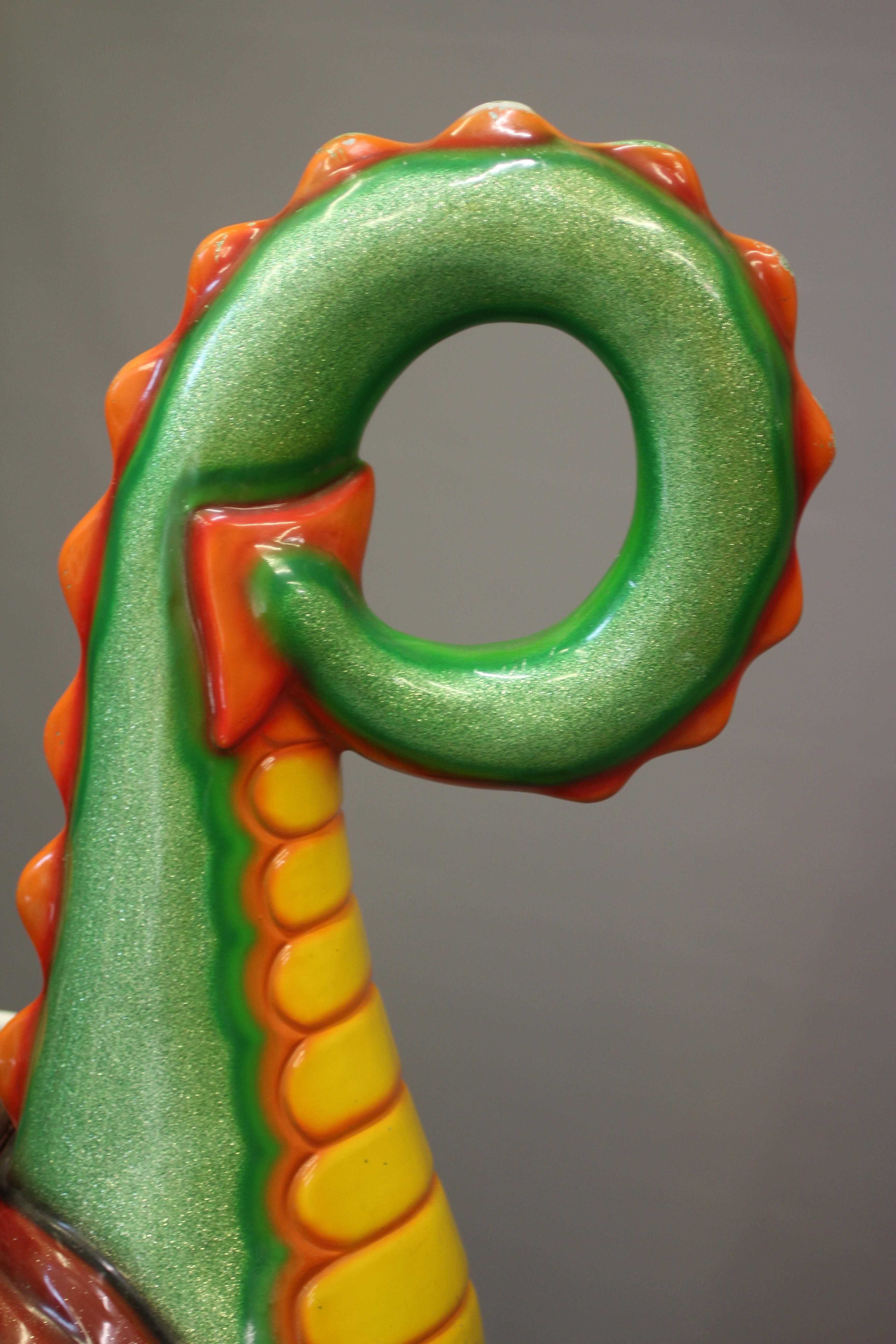 A Puff the Magic Dragon coin operated Whittaker Bros. kids ride, with 20p price, twin steering Image