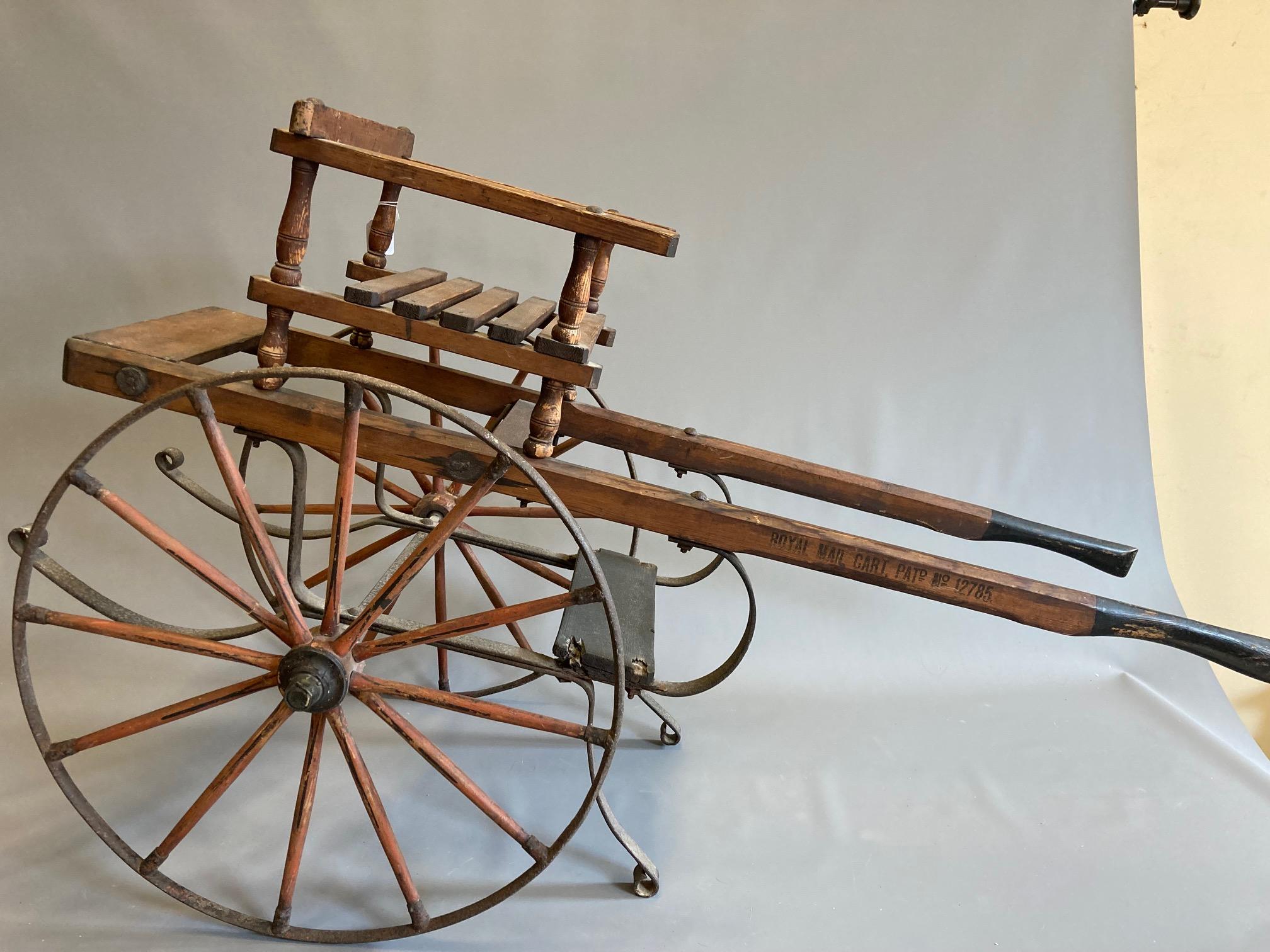 A Victorian "Royal Mail" dog cart, labelled 'Simpson, Fawcett & Co Leeds', of wood and metal Image