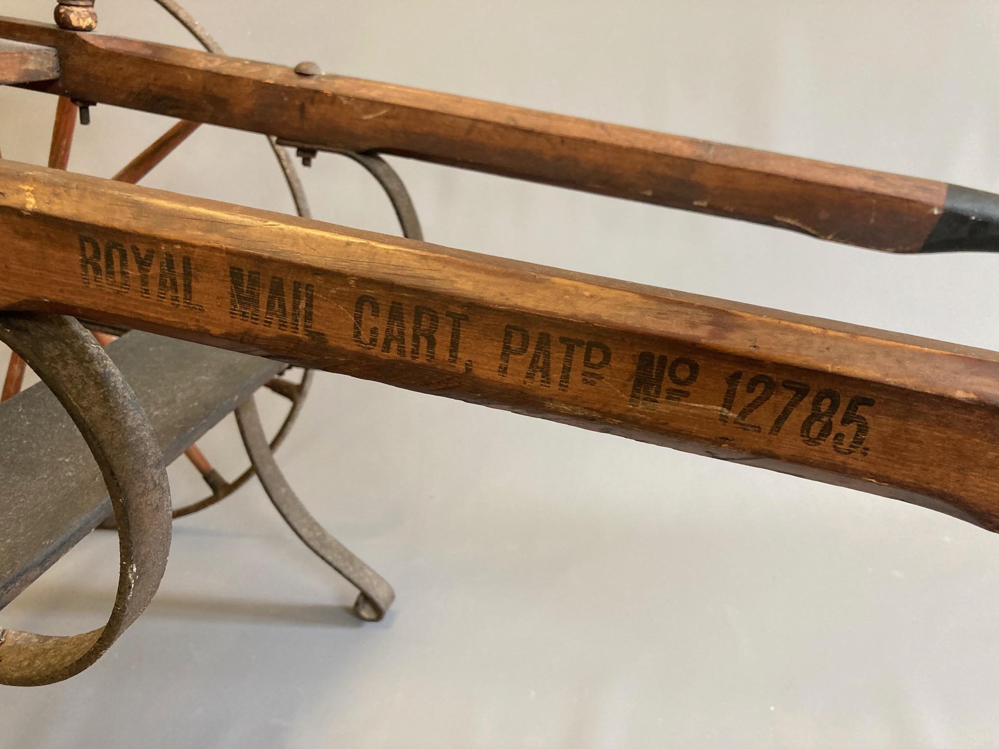 A Victorian "Royal Mail" dog cart, labelled 'Simpson, Fawcett & Co Leeds', of wood and metal Image