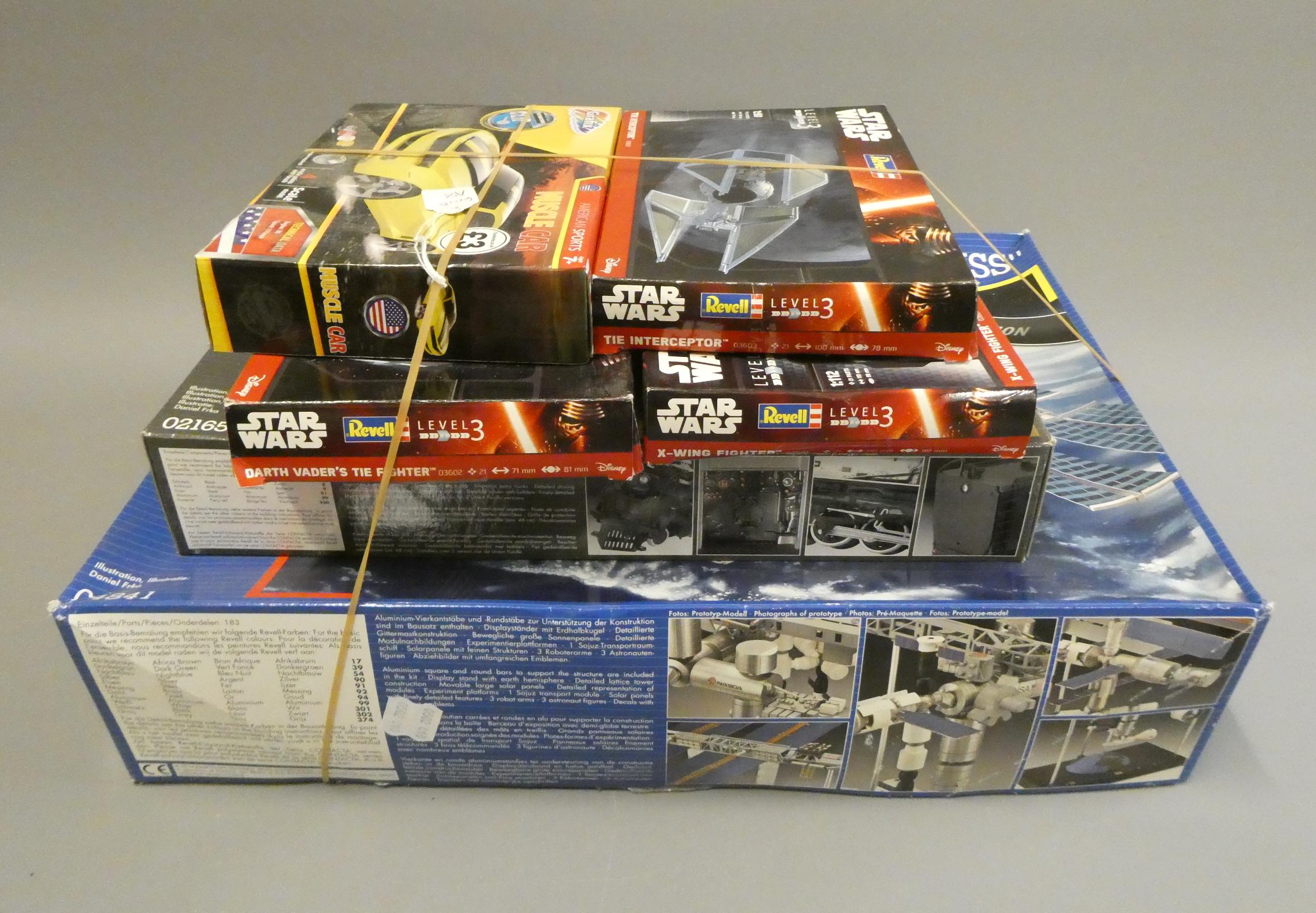 Revell space station kit, three Star Wars kits, BigBoy locomotive kit and Mustang kit. All items Image