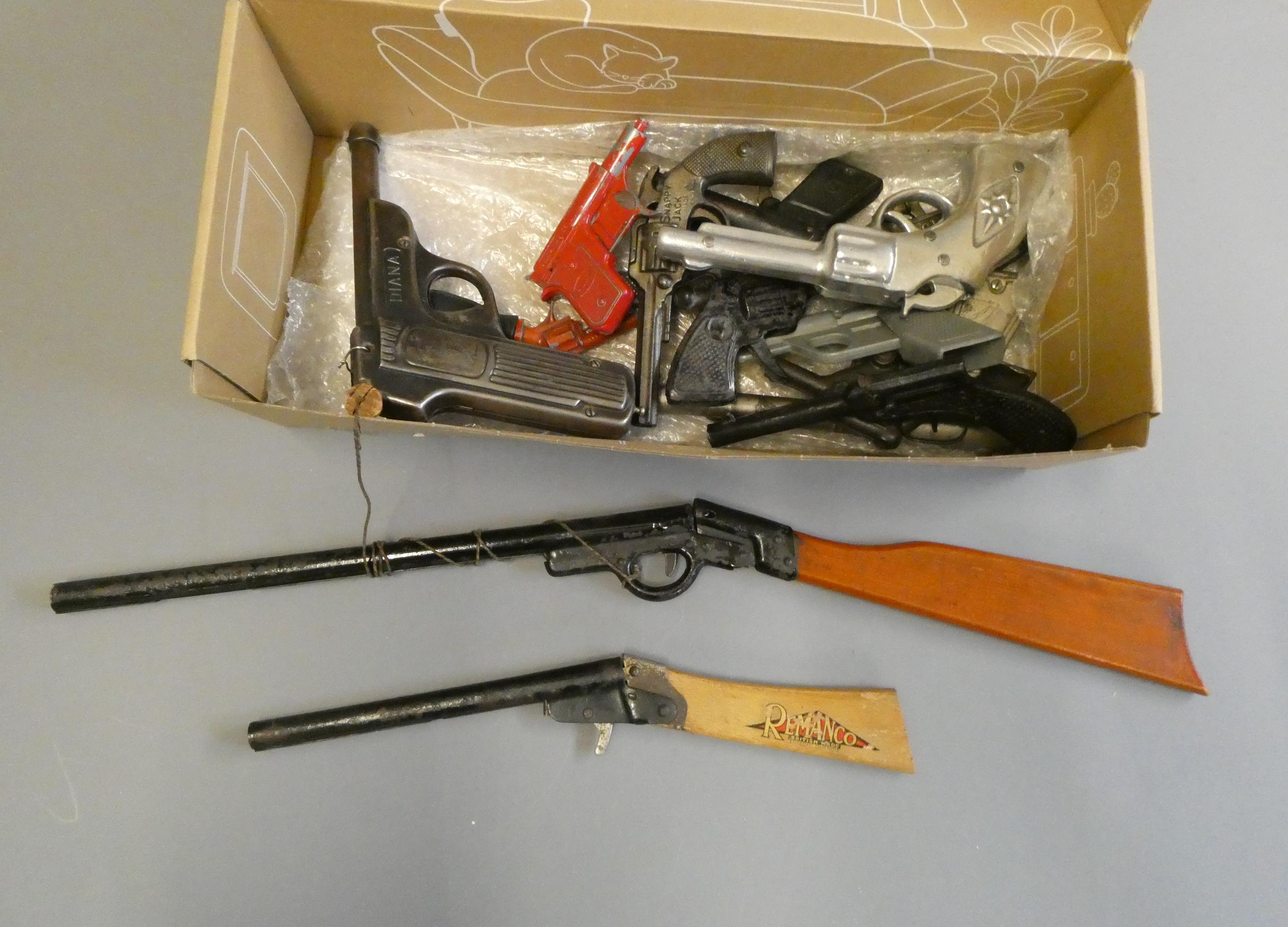 Twelve toy hand guns from various manufacturers and two toy rifles, some items have minor damage, Image