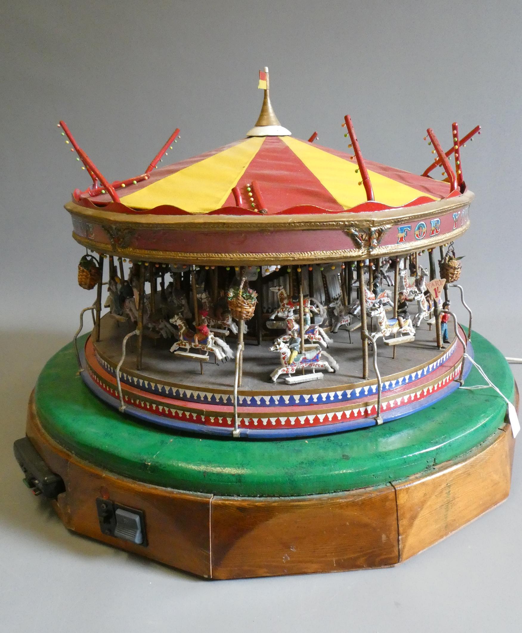 A handmade model gallopers merry-go-round roundabout of wood and brass construction with electric Image
