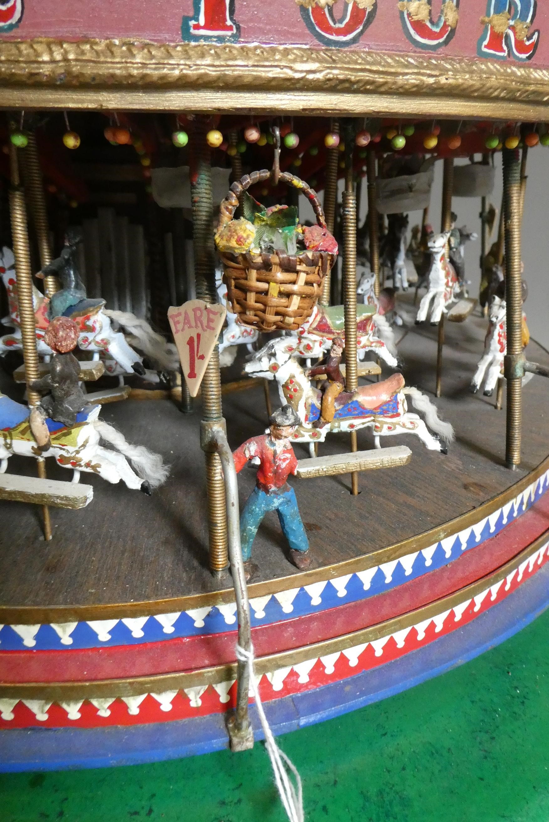 A handmade model gallopers merry-go-round roundabout of wood and brass construction with electric Image