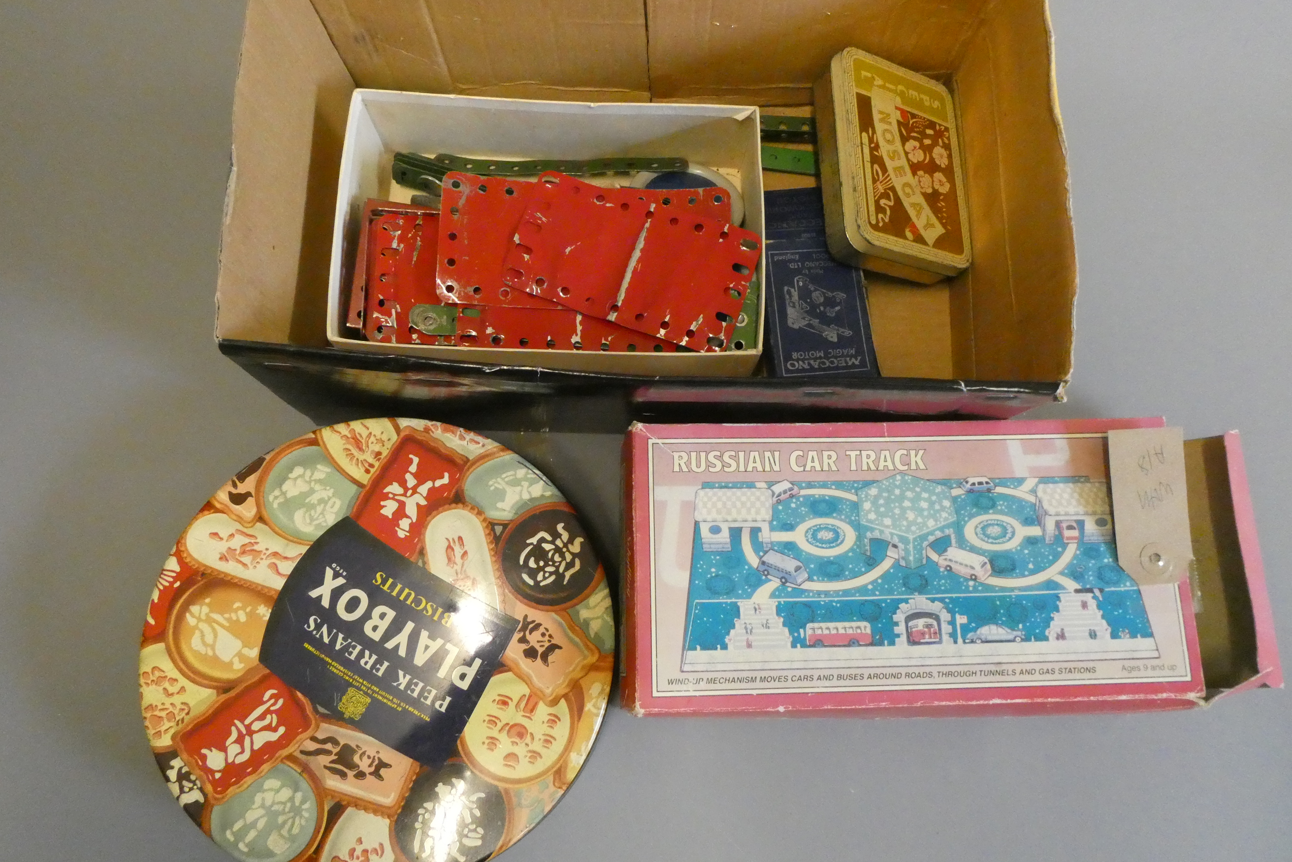 Playworn Meccano parts including small clockwork motor and Russian clockwork tin track toy (Est. Image