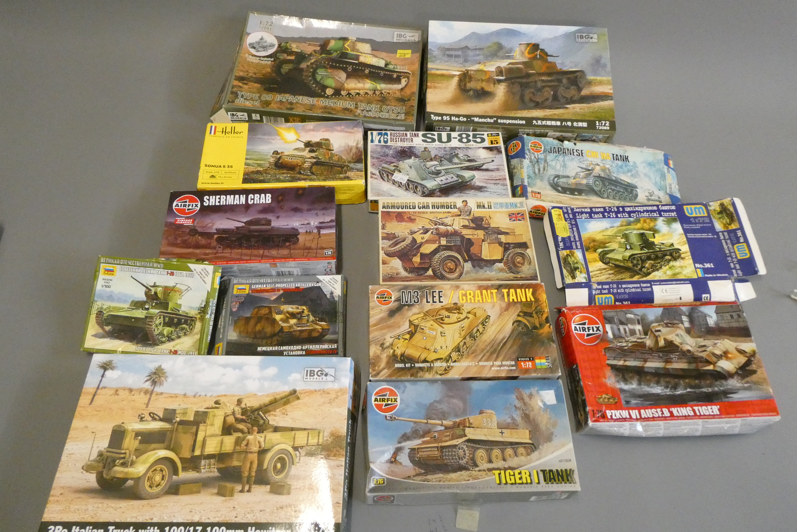 Fourteen plastic construction kits of tanks and armoured vehicles by Airfix and others Image