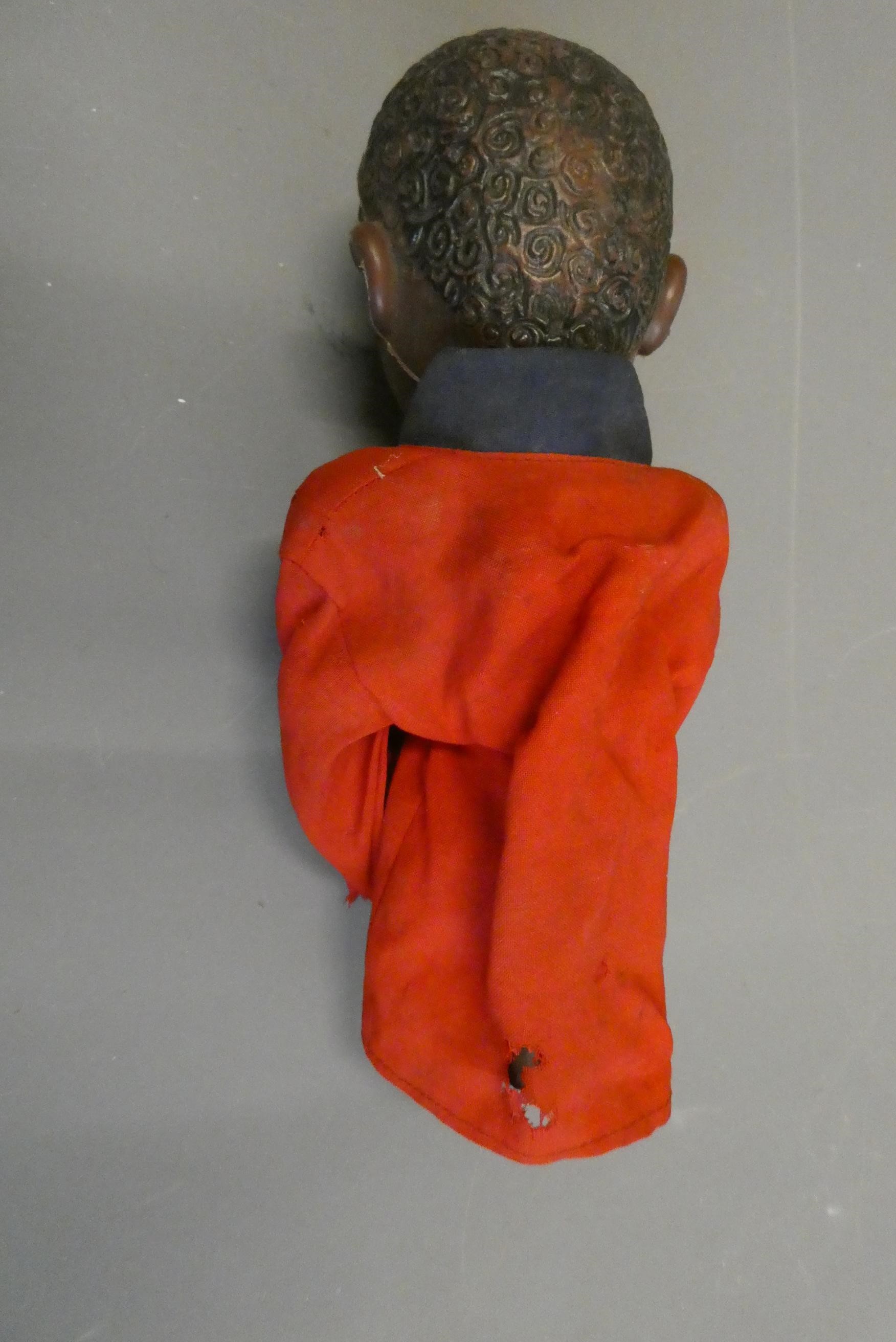 Boxer puppet with boxing action arms with a look of a very young Mohammed Ali. Some wear and holes Image