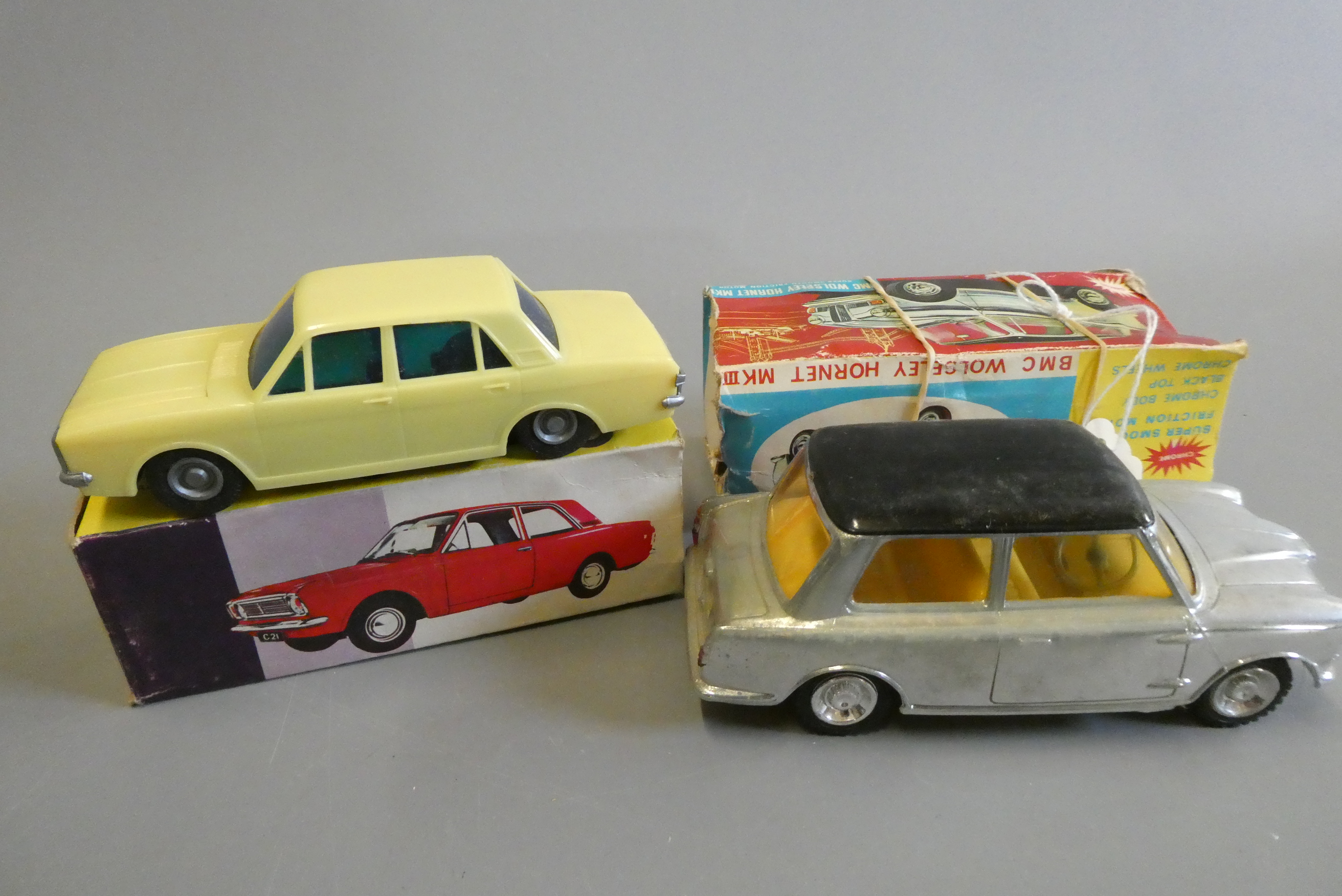 Plastic friction powered Ford Cortina GT finished in yellow Image