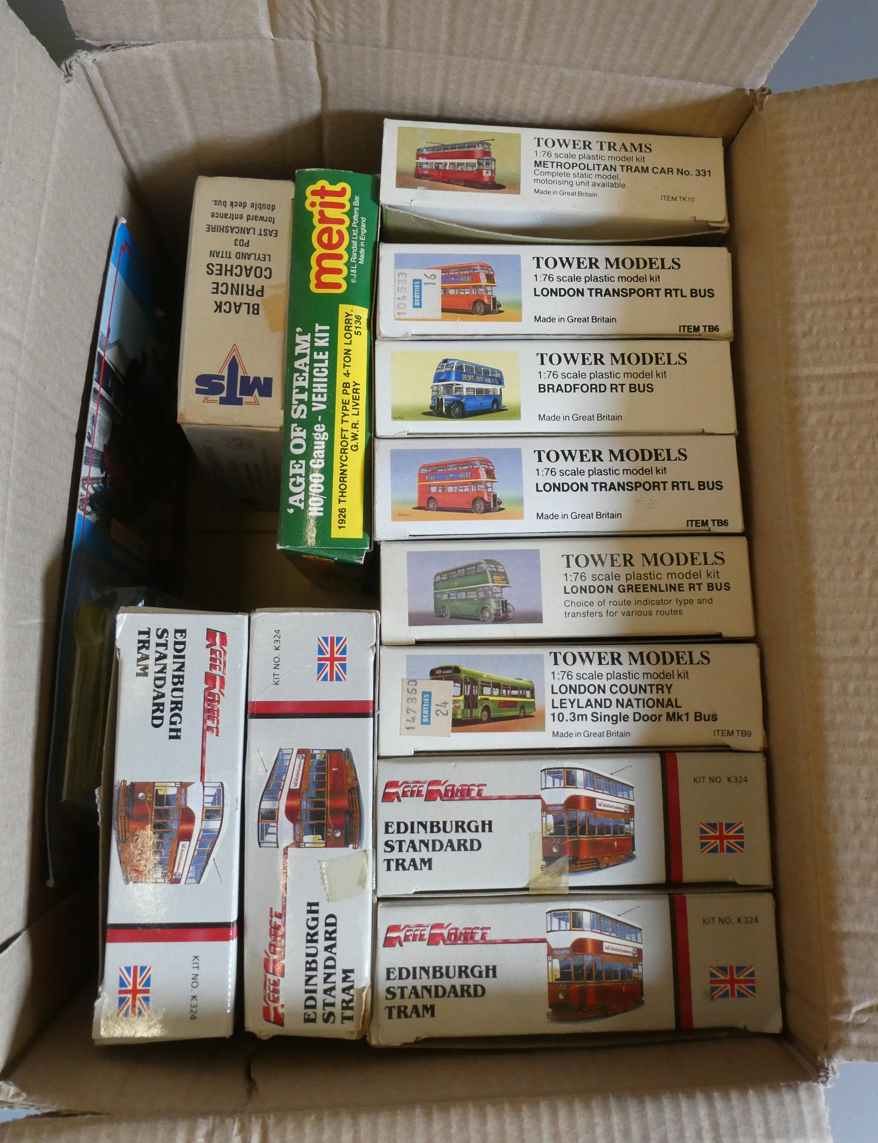 Eleven plastic model bus and tram kits, unchecked for completeness, and two Oxford diecast vehicles, Image